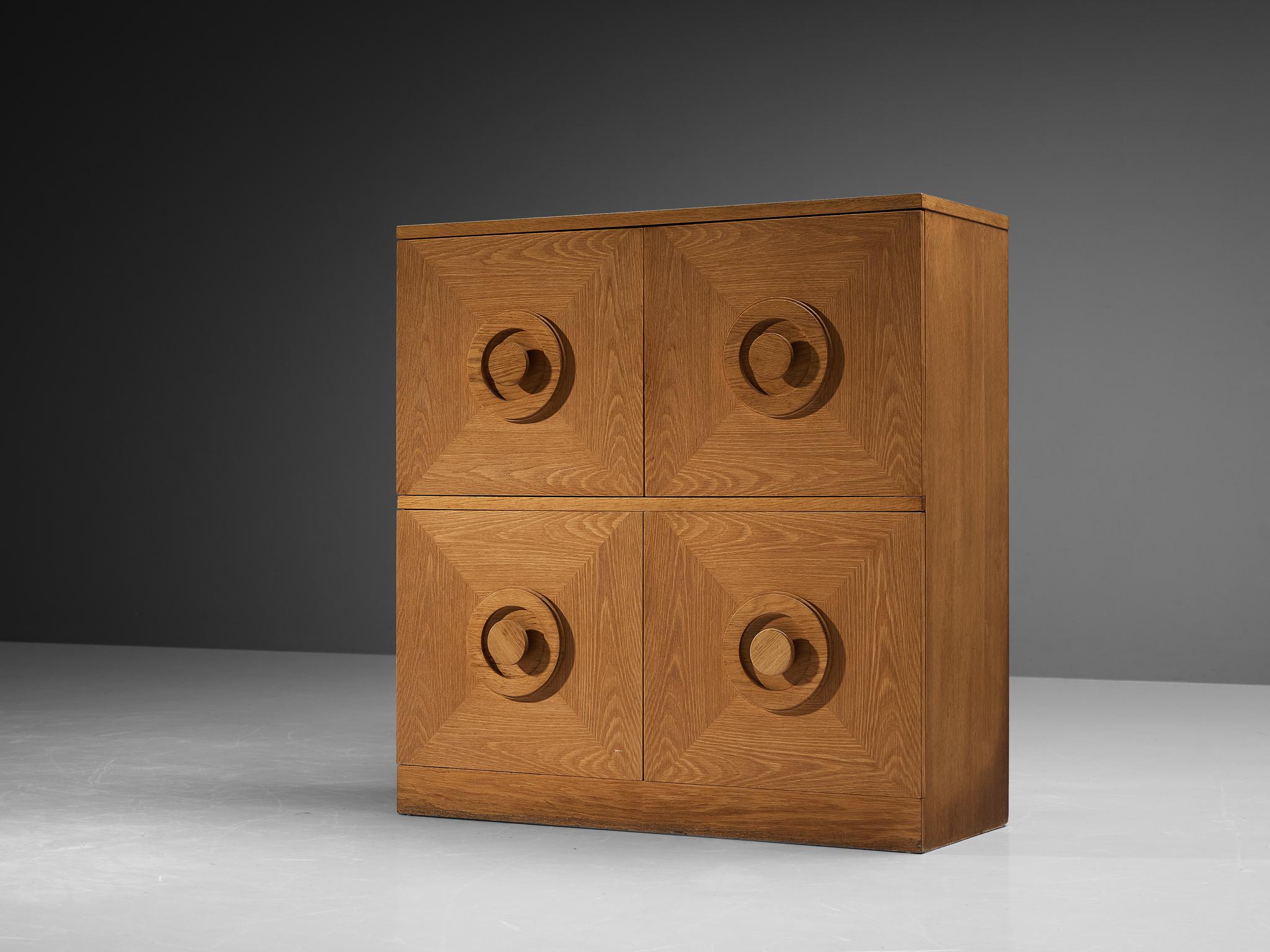 Highboard, stained oak, Belgium, 1970s. 

This very evocative cupboard features a clear rhythm and flow established by means of well thought through lay out that is utterly well-balanced. The round doorknobs immediately catches the eye and is the