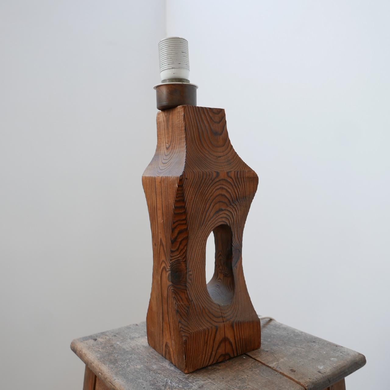 An unusual Brutalist style table lamp. 

Belgium, c1970s. 

With a formed handle. 

There is a historical crack which is likely to have been there since origin. 

Since re-wired and PAT tested. 

Dimensions: 42 H x 11 D x 13 W in cm.
 
