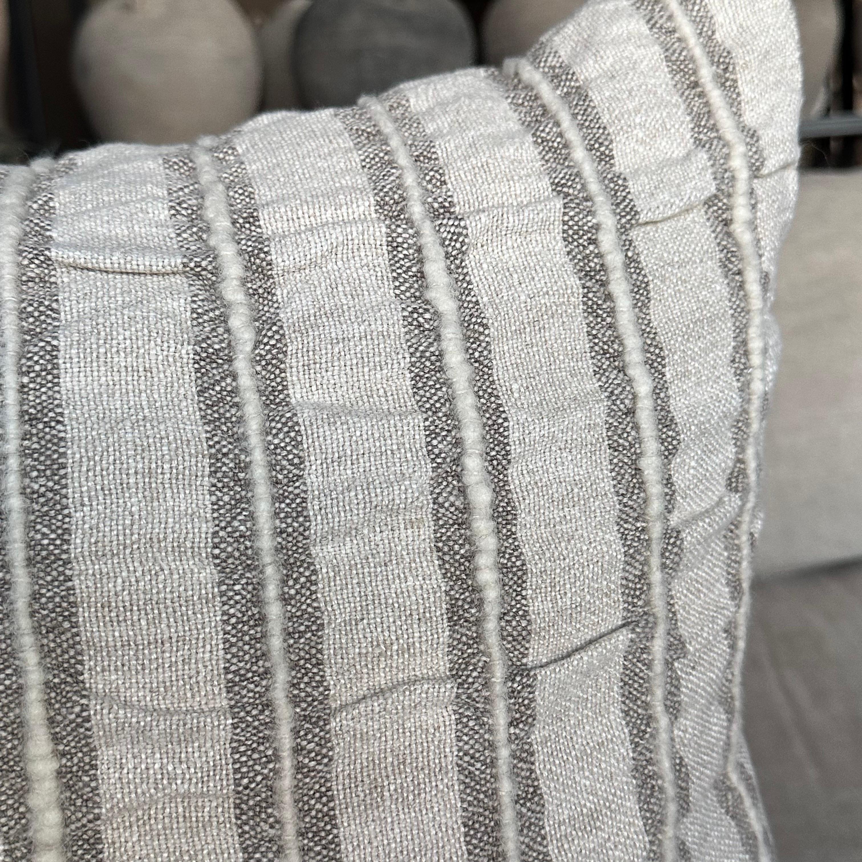 Linen and Wool Stripe Pillow
Nubby textured linen with woven wool stripes. 
Color: Gray / White
Hidden Zipper closure
Includes down / feather insert
Size: 15x24
Care: For best results dry cleaning is recommended.
Soft to the touch, handmade in