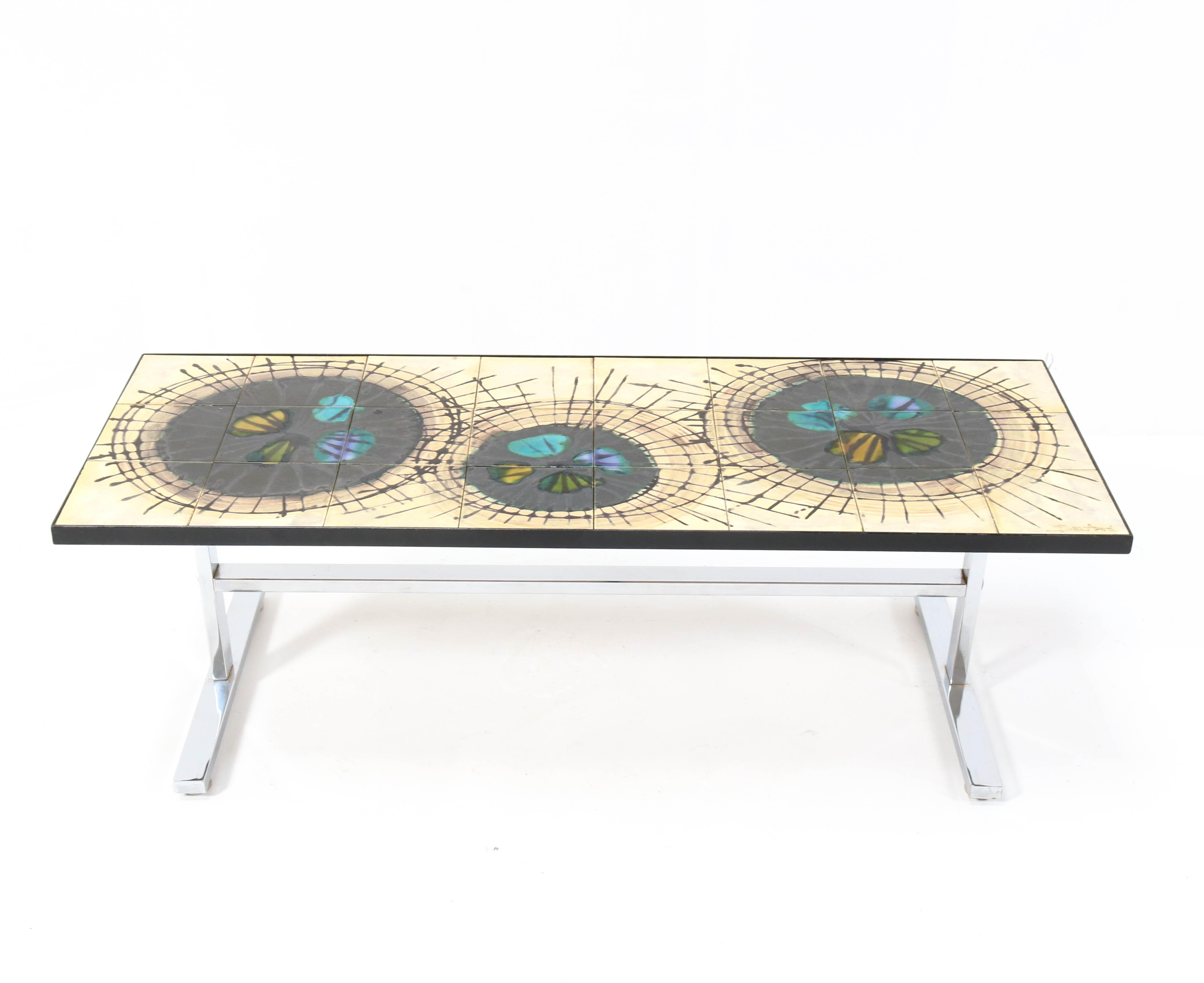 Wonderful Mid-Century Modern coffee table.
Design by Julliette Belarti.
Striking Belgium design from the 1960s.
Chrome plated frame with ceramic tile top.
Marked on the table top.
In good original condition with minor wear consistent with age