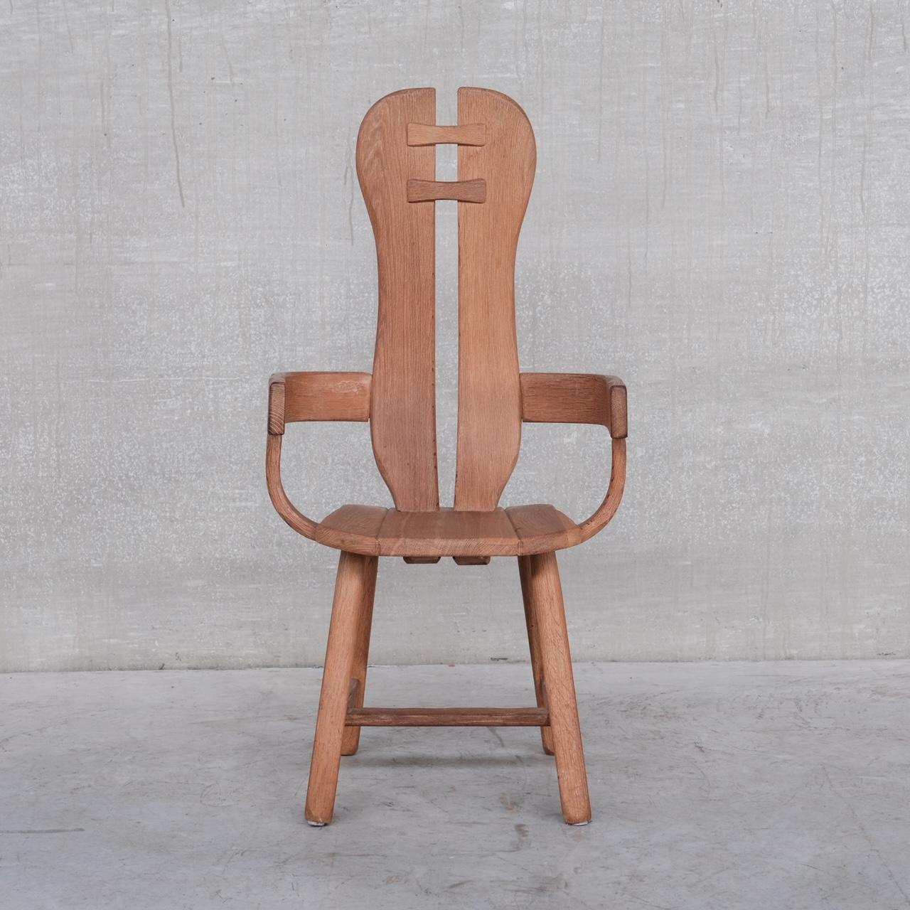 Oak dining or armchairs by De Puydt. 

Belgium, c1970s. 

A flexible chair that can be used in the dining room, living room or bedroom as an occasional chair. 

Some wear commensurate with age. 

Priced and sold individually. 

Location: Belgium