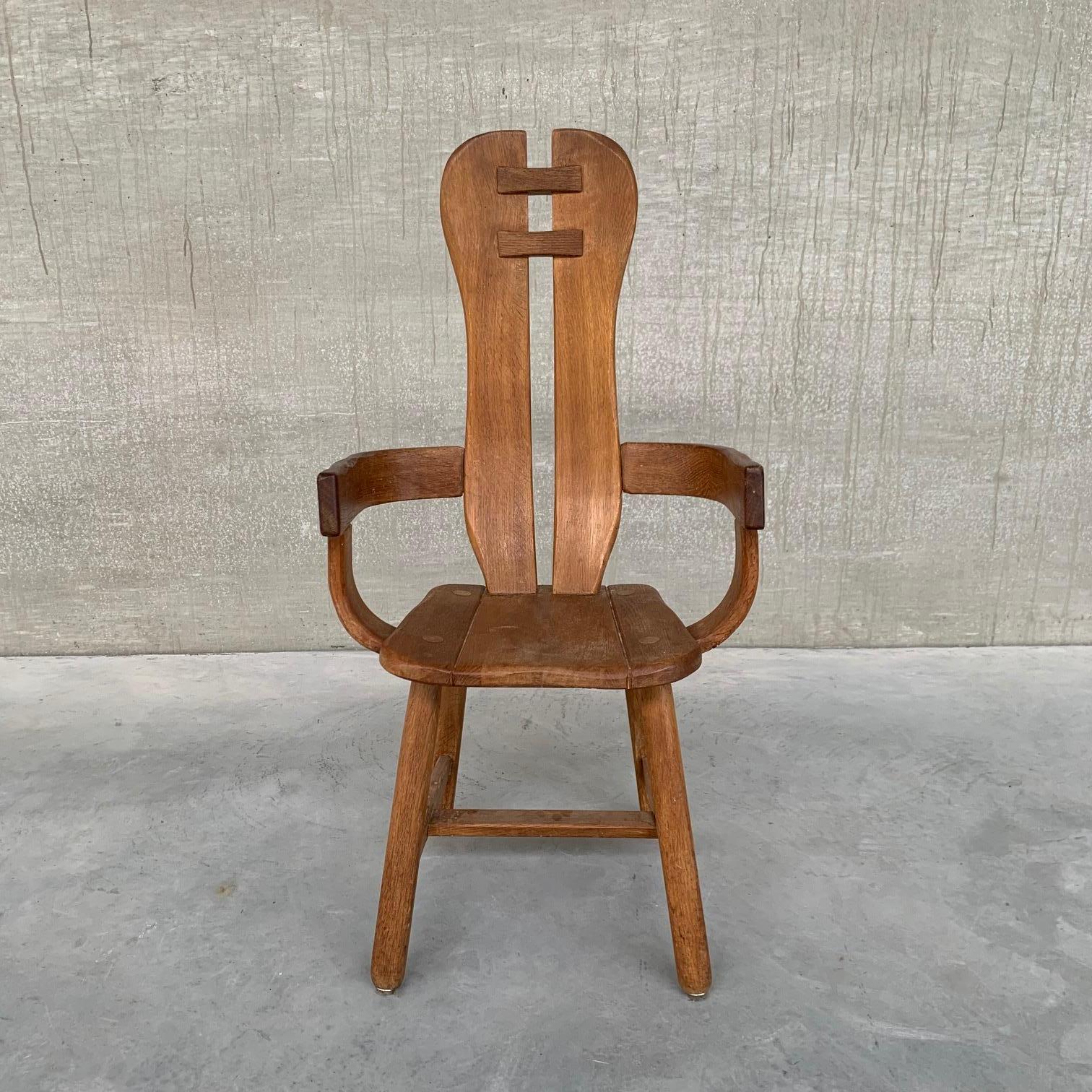 Oak dining or armchairs by De Puydt.

Belgium, c1970s.

A flexible chair that can be used in the dining room, living room or bedroom
as an occasional chair.

Some wear commensurate with age.

Priced and sold individually.

Location: Belgium