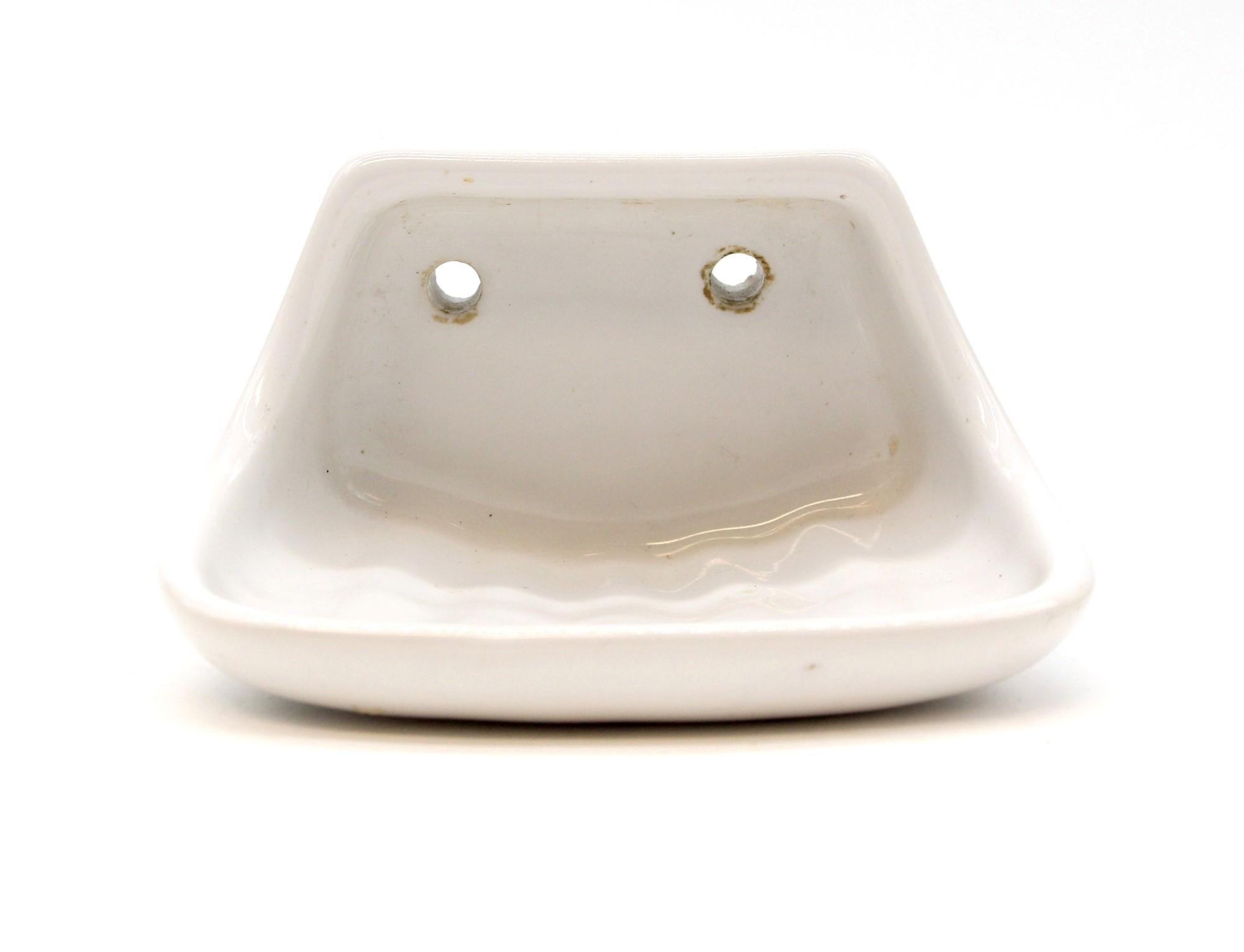 White ceramic soap dish from Belgium. Can be surface mounted with two screws. Small quantity available at time of posting. Priced each. Please inquire. Please note, this item is located in our Scranton, PA location.