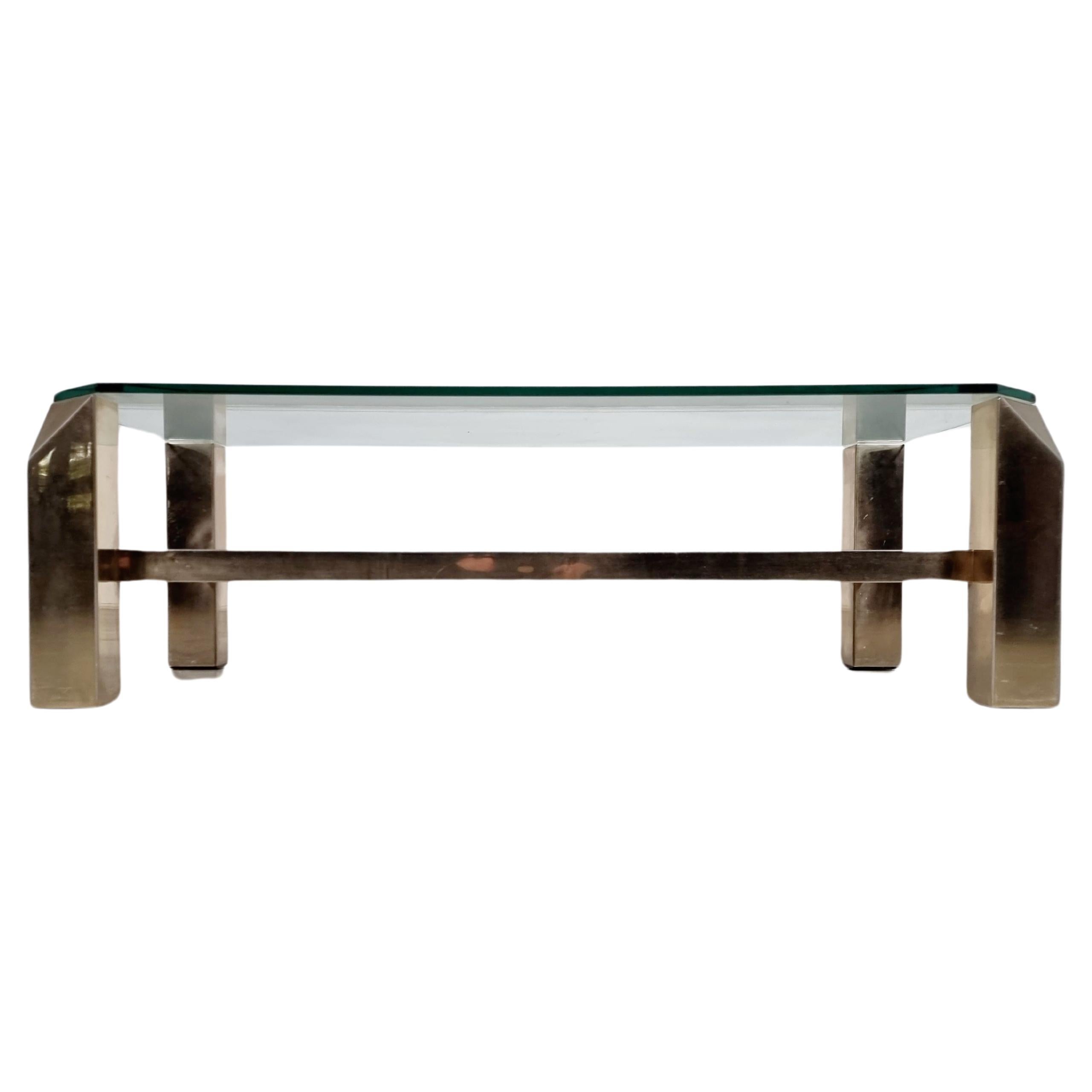 23-karat gold plated coffee table in eye-catching geometric style, manufactured by Belgo Chrom in Belgium around 1970.

It is made of high-quality brass with gold plating. The finish to the rectangular shapes of the base is really nice, with
