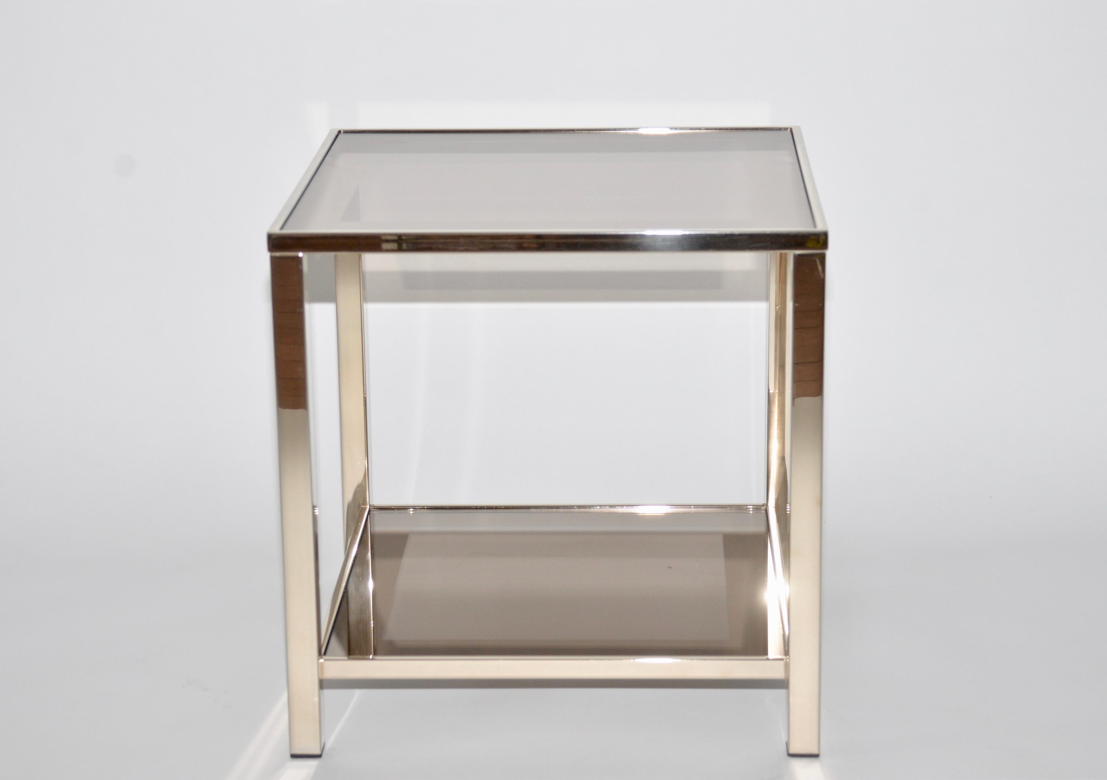 Belgo Chrome side table with an elegant tone to the gold plating with a sepia brown mirrored glass top with a 7cm border with another mirrored glass shelf below. An iconic Classic design of the 1980s when Belgo Chrome were known for their designs in