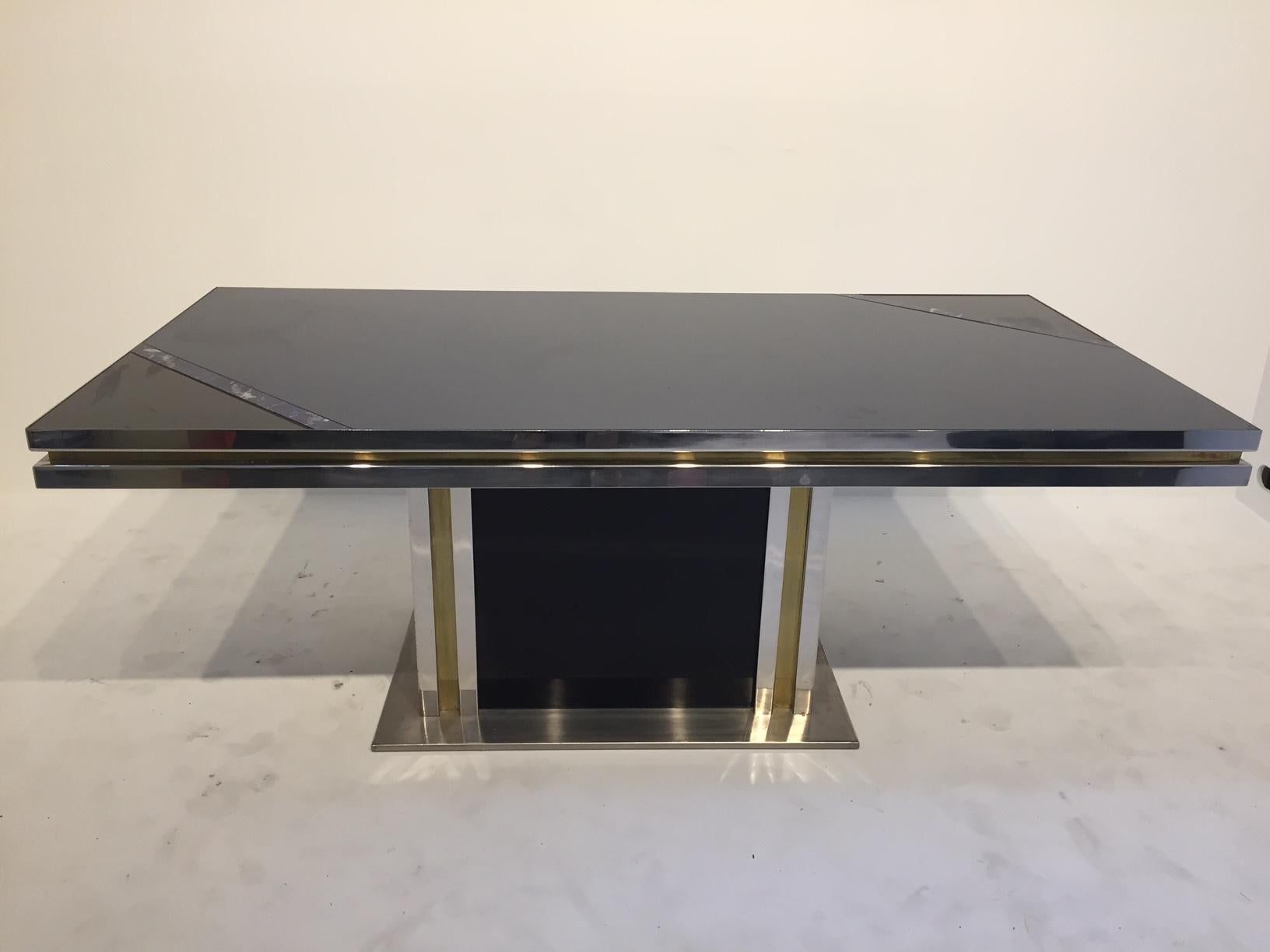 Dining table design in the 1980s.
Gold, chrome and colored glass with Lapis Lazuli inlays.