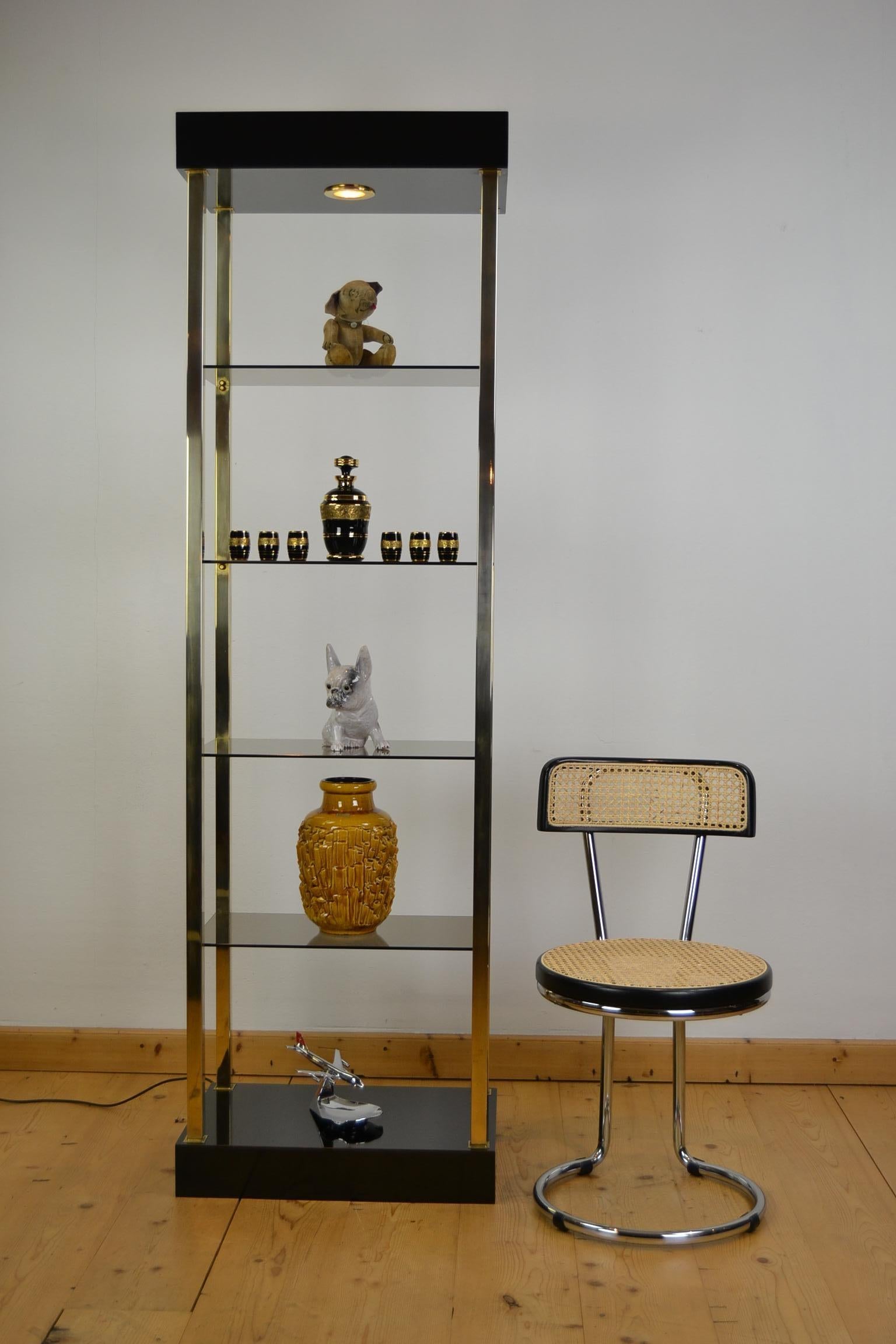 Belgo Chrome etagere, vitrine, shelves or showcase with light. 
A Hollywood Regency open vitrine with glass shelves made by Belgo Chrome, Belgo Chrom - Belgochrom Belgium in the period 1970 - 1980. 
It has a black lacquered bottom and top,