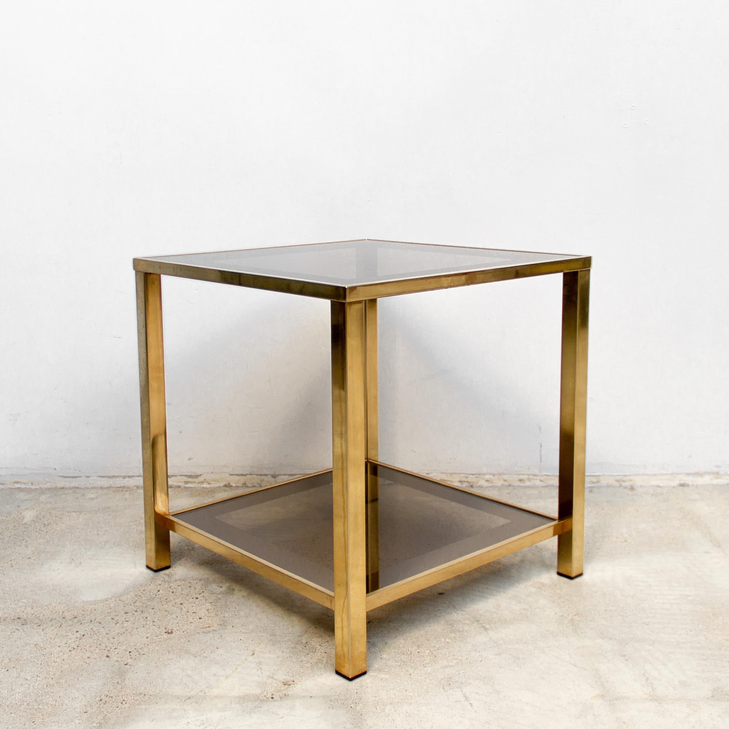 23-karat gold-plated side table with shelf circa 1980s Belgian. Finished in an attractive and elegant soft gold tone this table is an alternative choice to yellow gold or chrome. The minimal form and warm metallic tones make this table suitable for