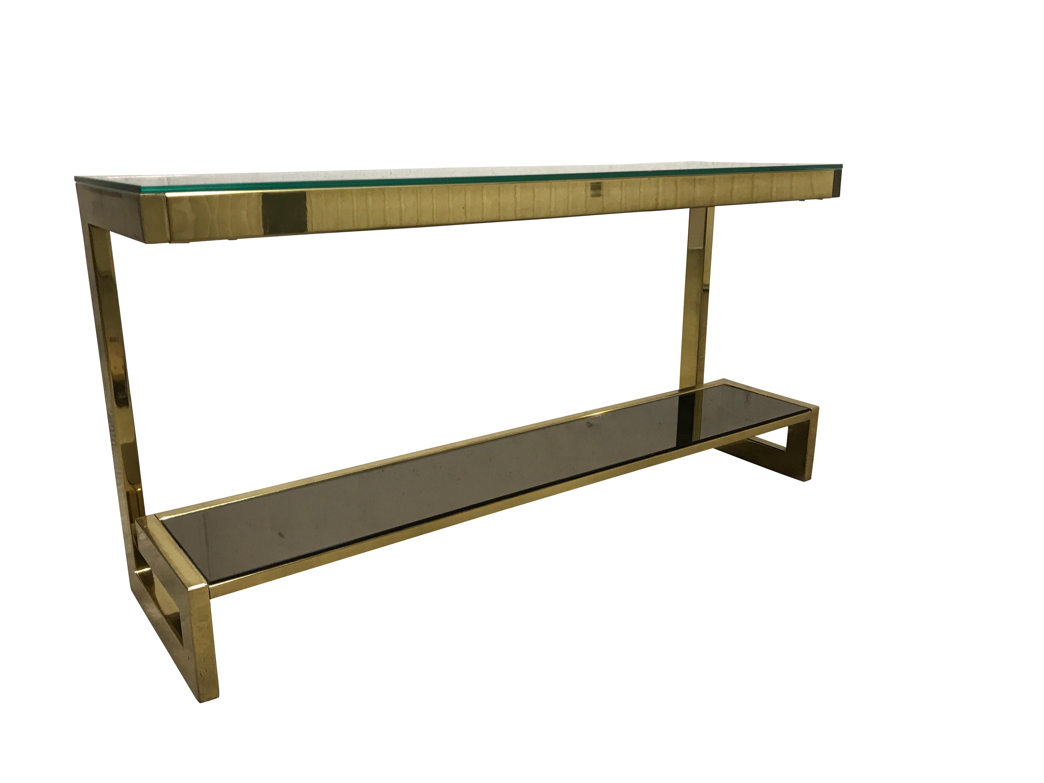 23-karat gold layered 'G'-shaped console table produced by Belgochrom.

The table has smoked glass and clear glass tops

Good condition, slight scratches on the brass.

1970s - Belgium

Measures: Height 70cm/27.55