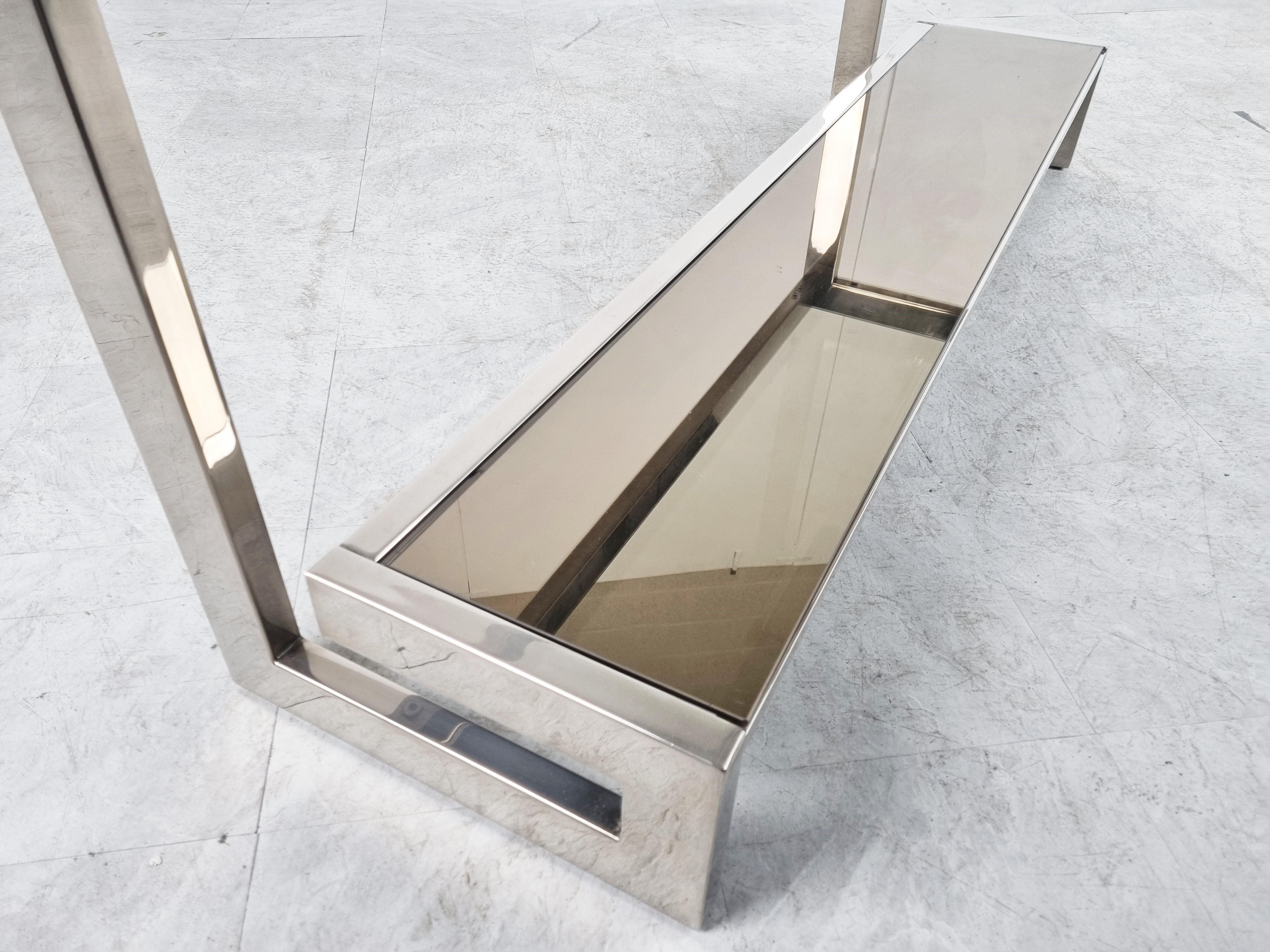'G'-shaped console table produced by Belgochrom.

The table has mirrored and clear glass tops

Chromed metal

1970s - Belgium

Measures: height: 74cm/29.13