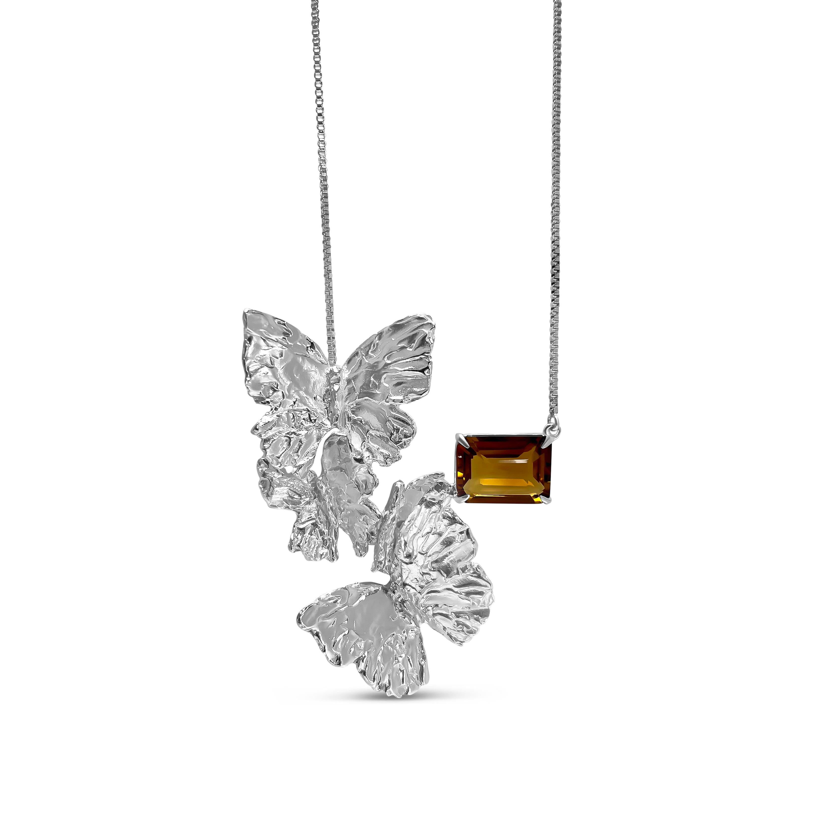 Intention: Sky's the limit

Design: Suspended from a length of silver chain, 4 hand carved butterflies are joined with a dollop of emerald cut citrine. Forming a graceful 
