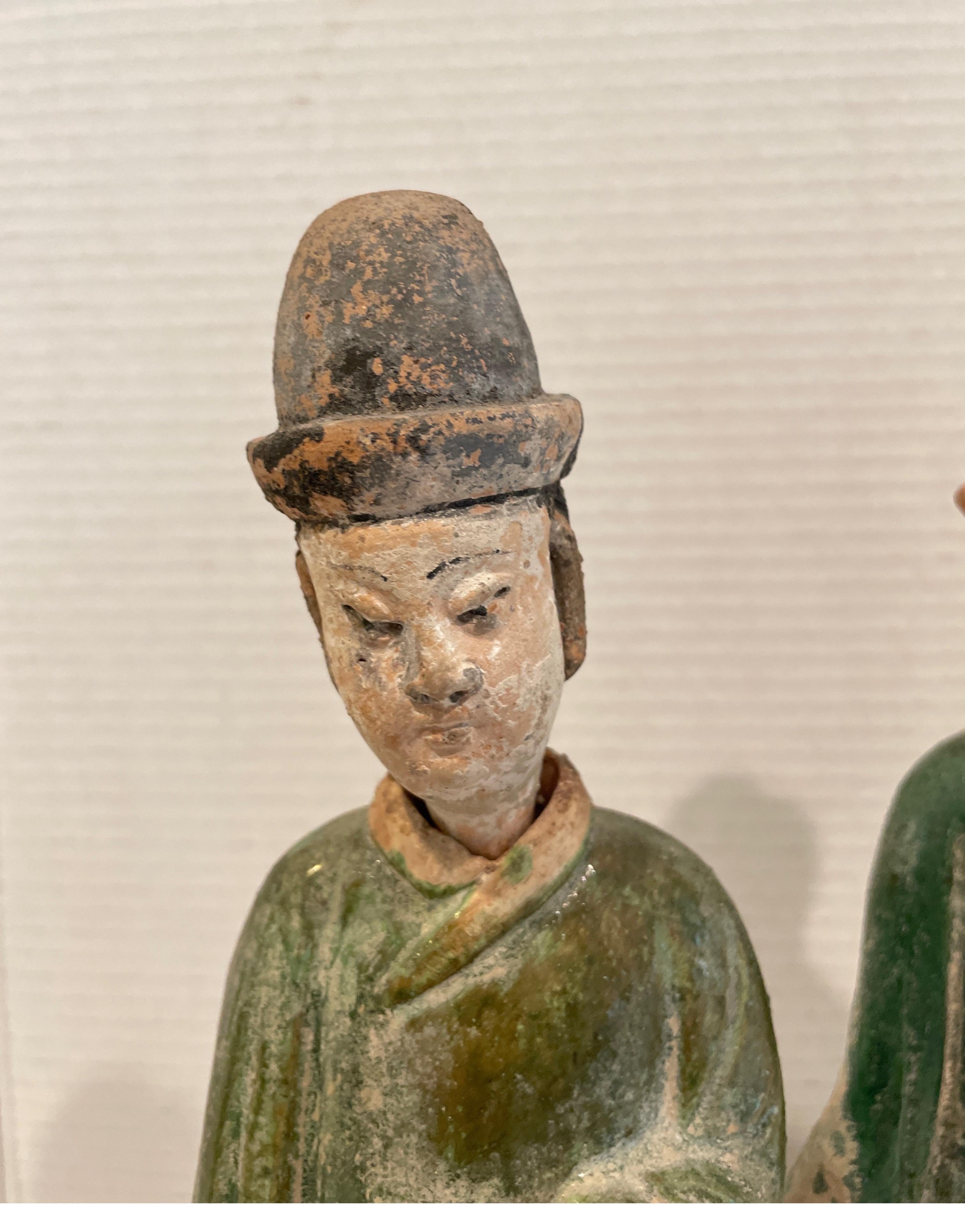 A pair of pottery dignitary tomb figures from the Ming Dynasty era. 