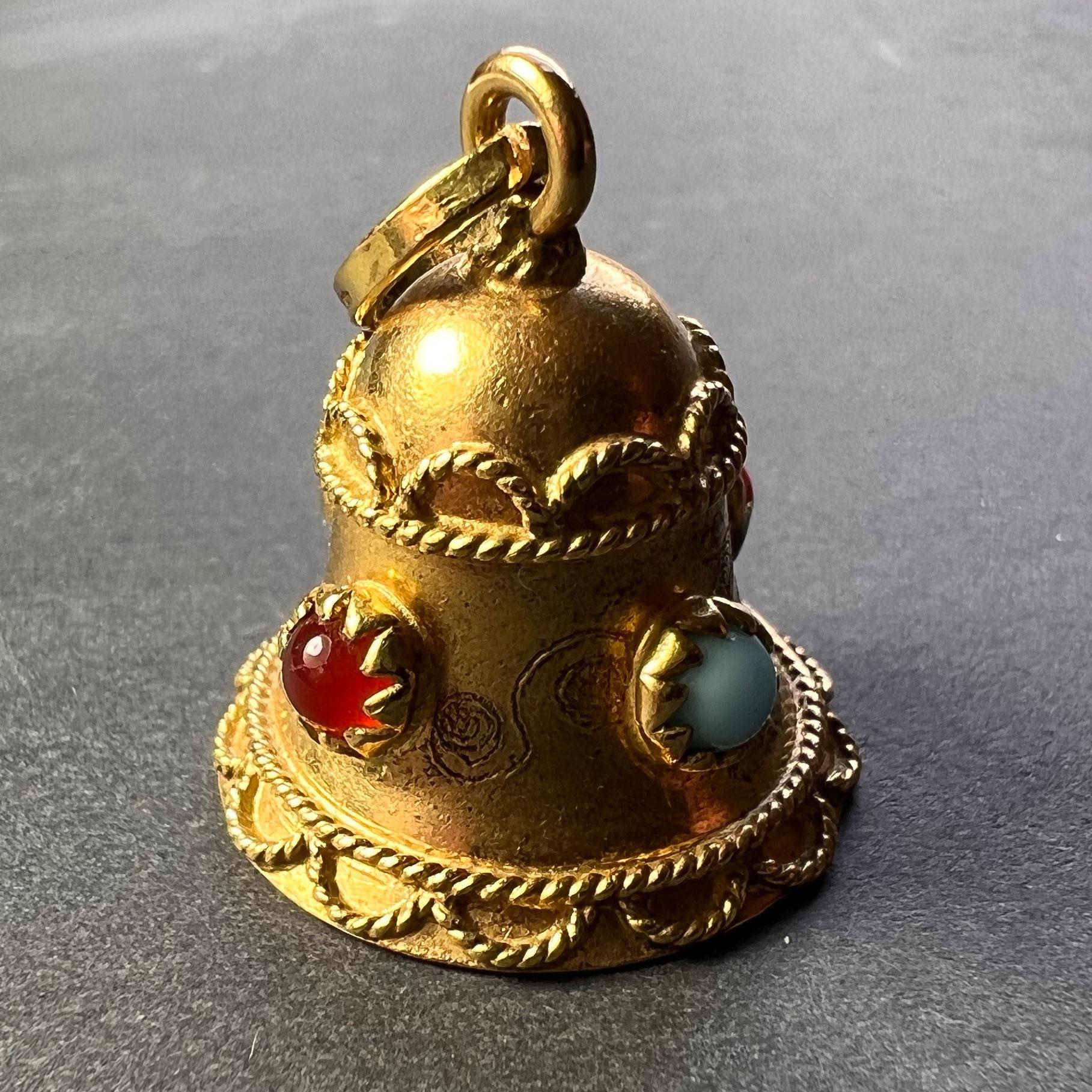 An 18 karat (18K) yellow gold charm pendant designed as a lucky bell set with paste cabochon with a red paste clapper. Stamped 750 for 18 karat gold and 13AR for Italian manufacture to the bail.
 
Dimensions: 2 x 1.65 x 1.65 cm (not including jump
