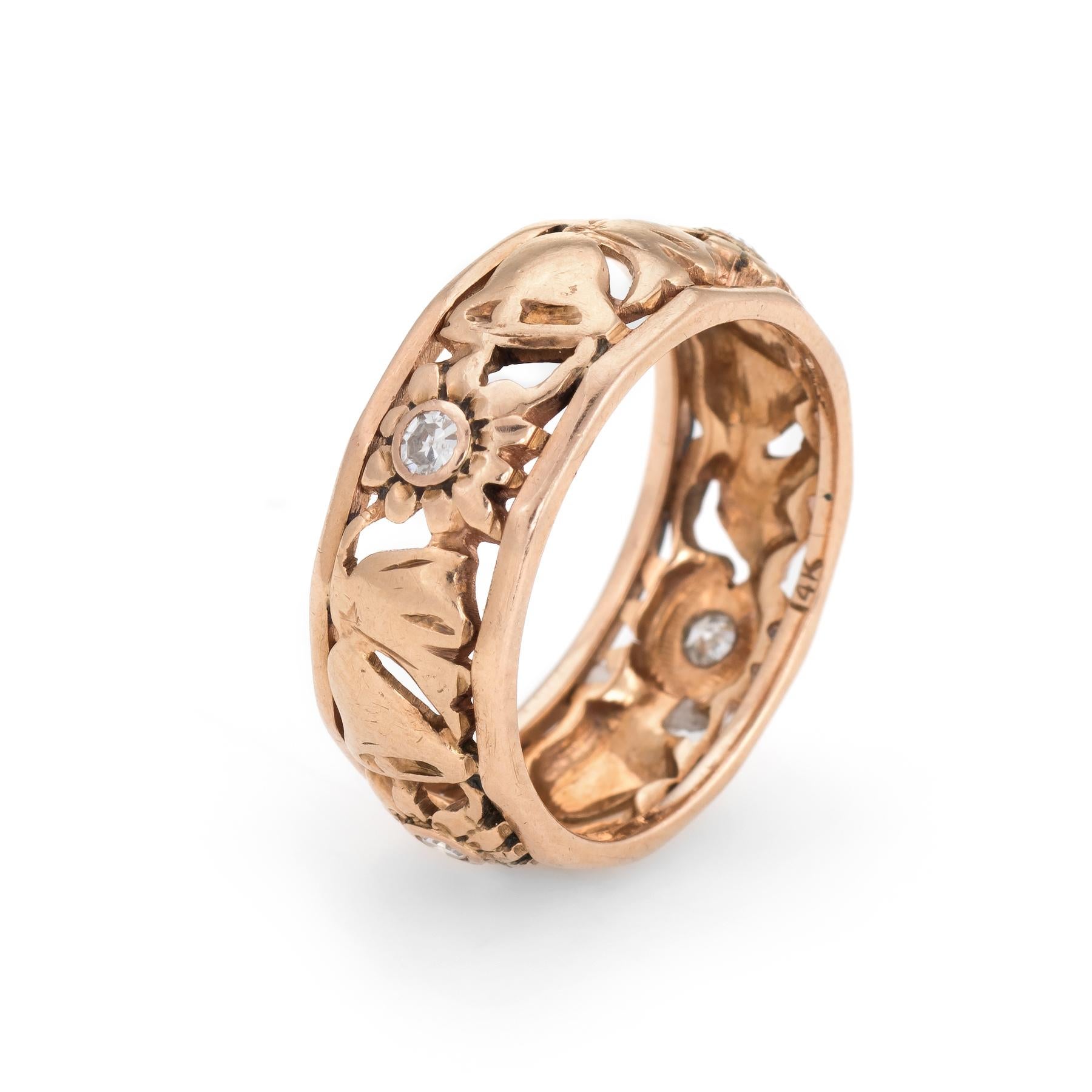 Elegant vintage wedding band (circa 1950s to 1960s), crafted in 14 karat rose gold. 

Four single cut diamonds are estimated at 0.04 carats each and total an estimated 0.16 carats (estimated at H-I color and SI2-I1 clarity).

Charming flower and