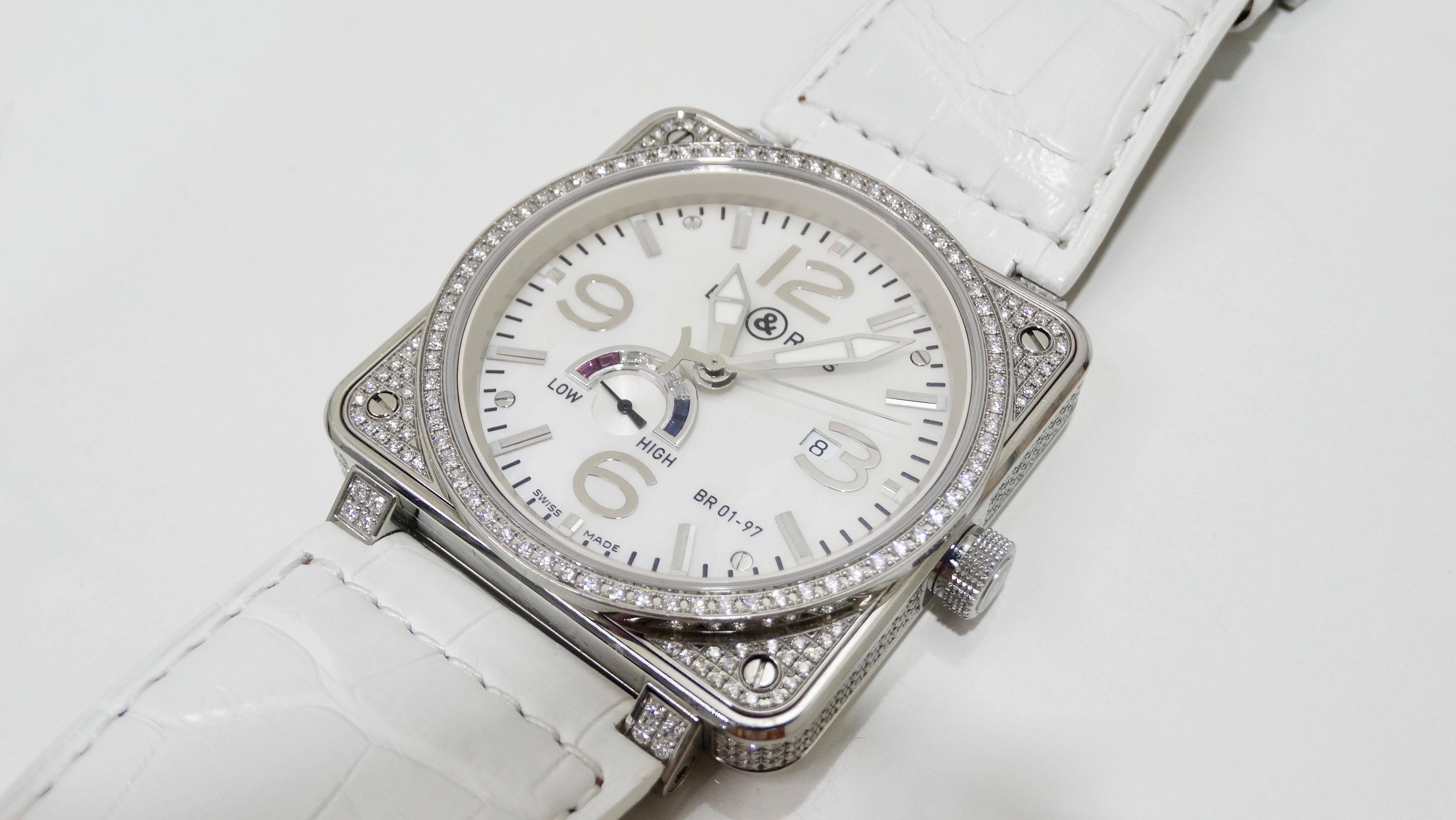The watch of your dreams is here! Designed by Bell & Ross, this rare BR 01-97 Power Reserve wrist watch is Swiss made and features a 46mm square stainless steel case fully encrusted with 316 3.34ctw diamonds, a Mother of Pearl dial, an
