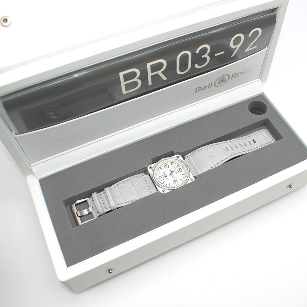 Bell & Ross Grey and White BR 03-92 Watch

Platinum detail 
Crystal-lined circumference
Genuine leather strap; crocodile embossing
Wide strap
Notches for adjusting wrist

Please note, these items are pre-owned and may show signs of being stored even