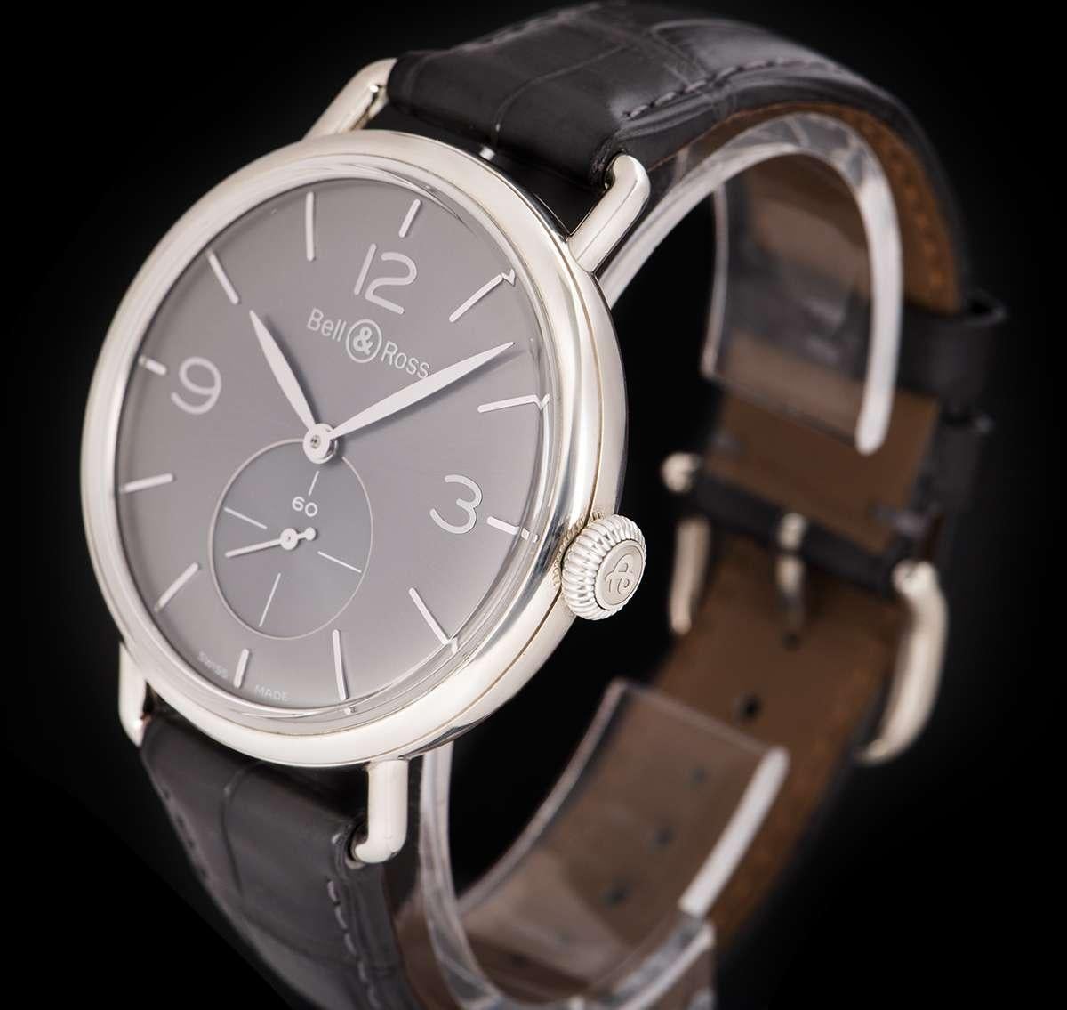 An Argentium Silver Vintage Gents Wristwatch, silver dial with applied hour markers and applied arabic numbers 3, 9 and 12, small seconds at 6 0'clock, a fixed argentium silver bezel, an original grey leather strap with an original argentium silver
