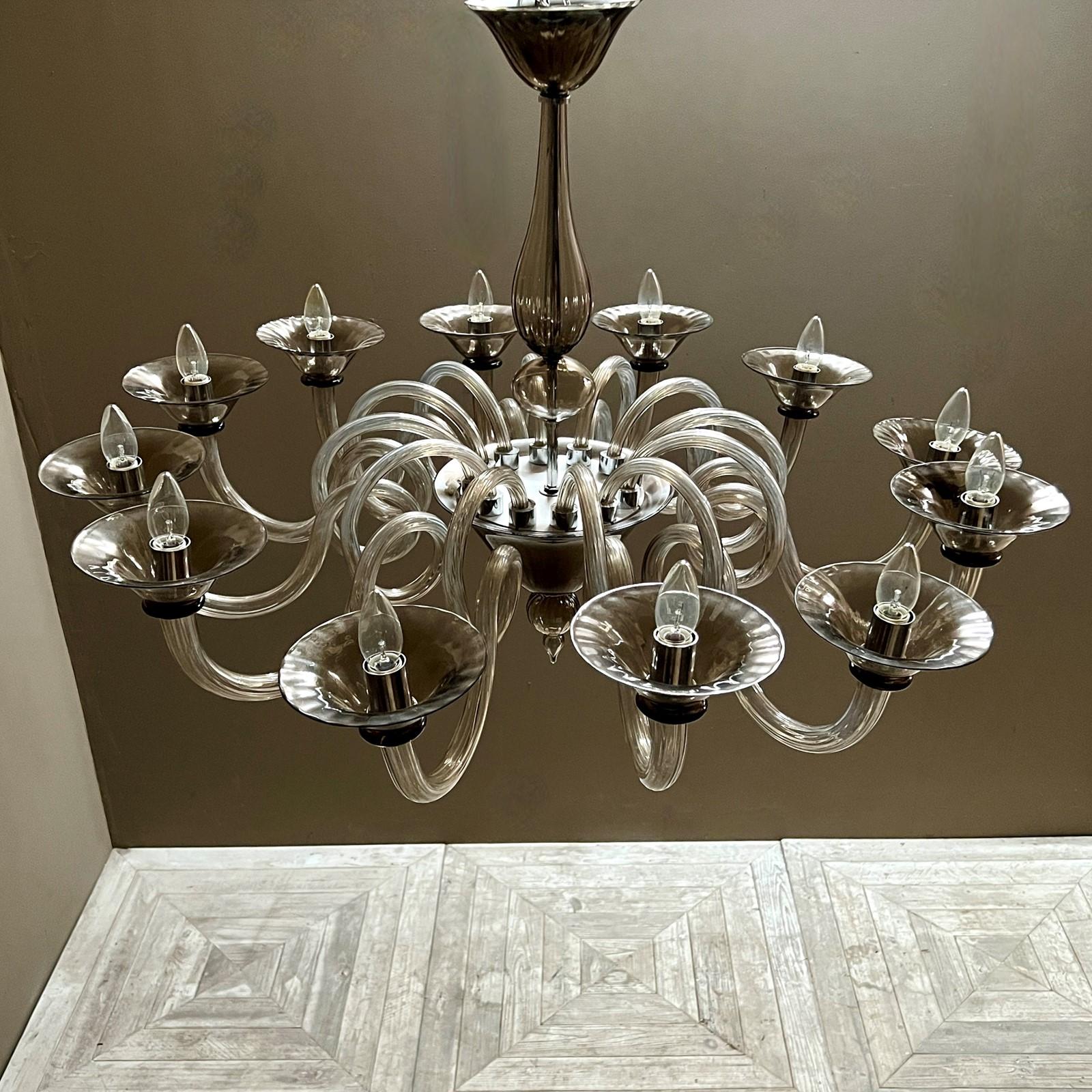 A beautiful and grand Italian Glass Chandelier by Bella Figura. Pair available. One of Bella Figura's all time most popular designs, which is ideal for transitional interiors and being sold at at fraction of its original cost when commissioned.