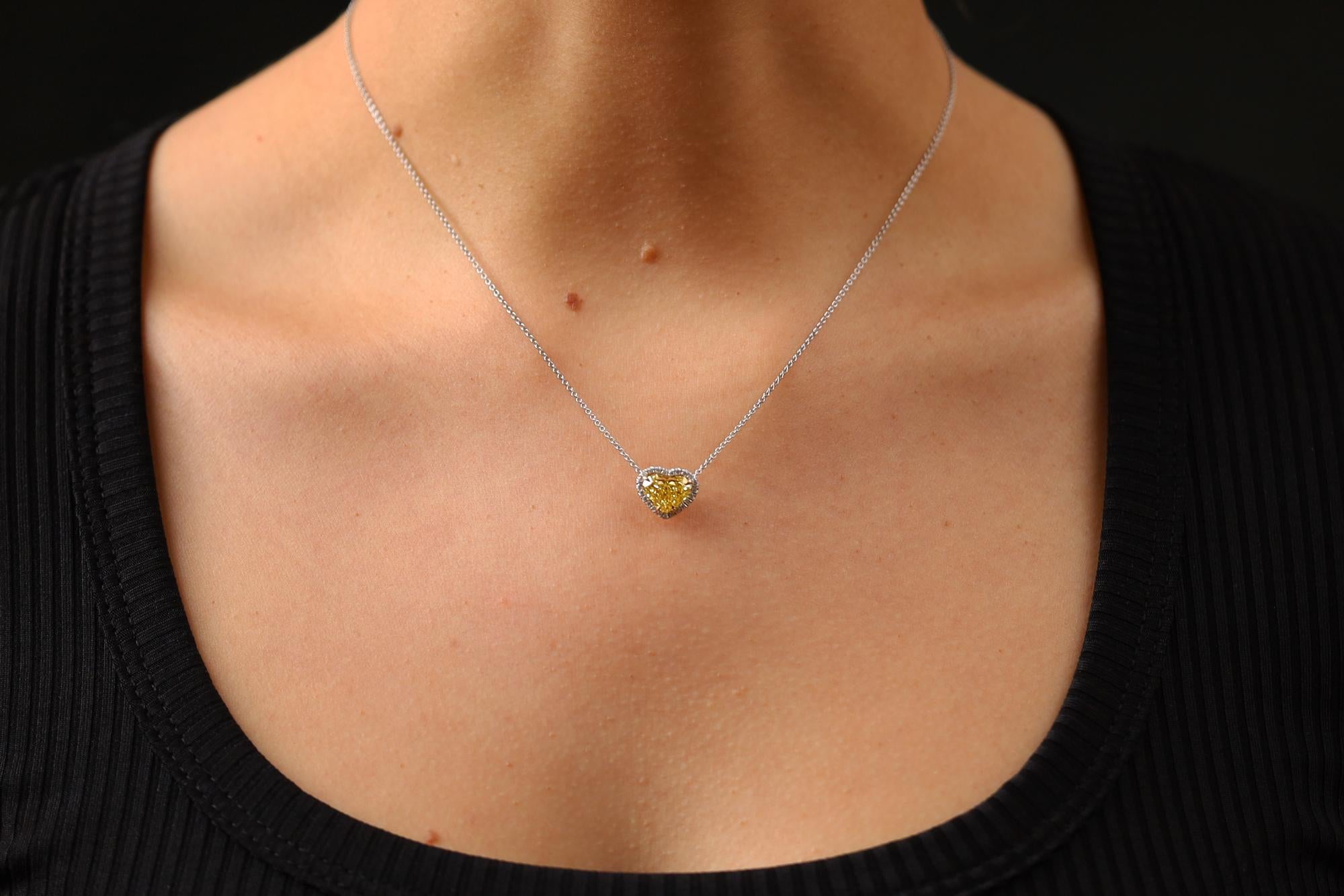 Create a lasting legacy with this vintage yellow diamond heart necklace. At 2.12 carats and cut with accurate precision, this well proportioned GIA certified diamond is graded fancy vivid yellow, which means the deep color is so rare and yes, vivid!