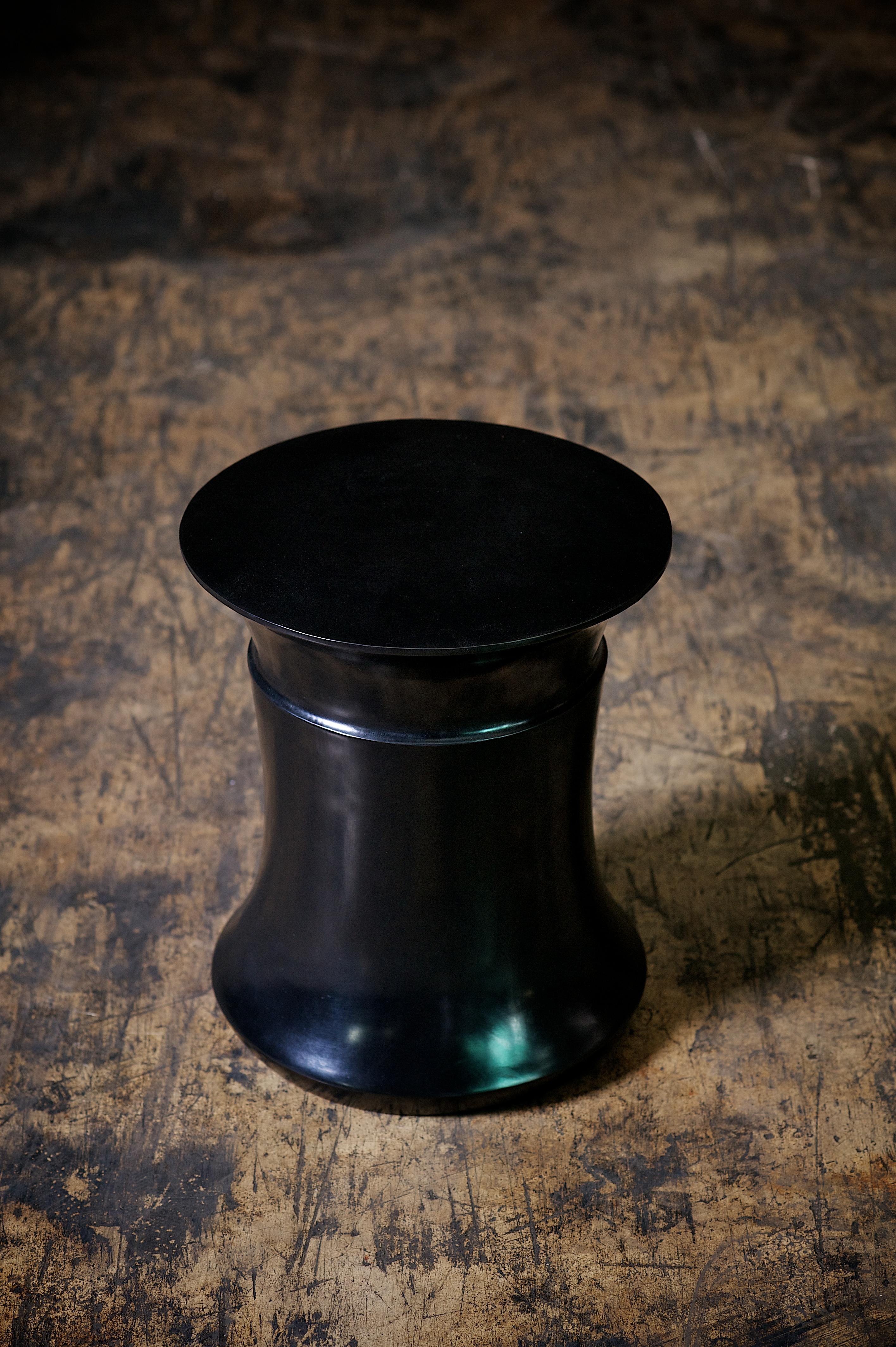 Sculptural Bella stool in lost wax cast bronze. Shown in dark bronze finish. Custom sizes and finishes are available.