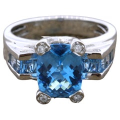 Bellarri Goldring mit blauem Topas und Diamant