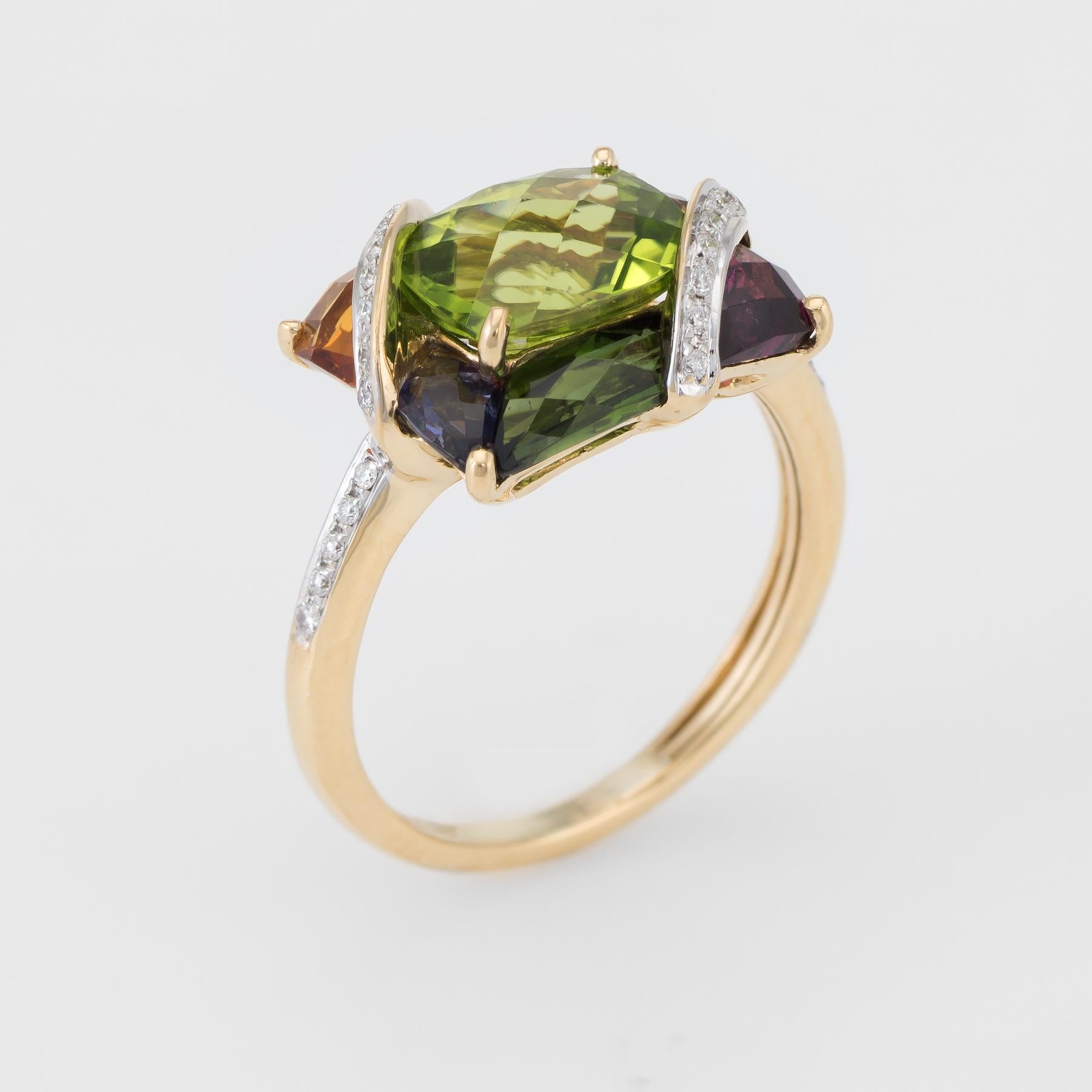 Finely detailed pre owned Bellarri cocktail ring, crafted in 18 karat yellow gold. 

Centrally mounted checkerboard faceted peridot measures 9mm x 7mm (estimated at 2 carats), accented with amethyst, green & pink tourmaline, and citrine. The