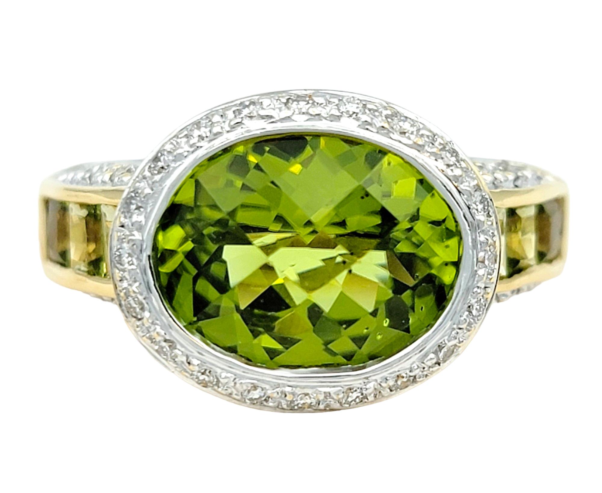 Ring Size: 7

This stunning Bellarri peridot and diamond ring, set in lustrous 18 karat yellow gold, is a mesmerizing piece of fine jewelry that captures the essence of elegance and sophistication. At the heart of the ring lies a striking large oval