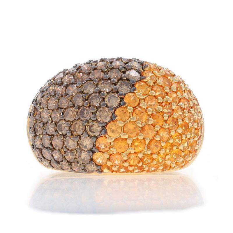 Size: 8 1/2
Sizing Fee: Up 1/2 a size for $50 or Down 1/2 a size for $50

Brand: Bellarri

Metal Content: 18k Yellow Gold

Stone Information
Natural Spessartite Garnets
Carat(s): 2.32ctw
Cut: Round
Color: Orange

Natural Diamonds
Carat(s):