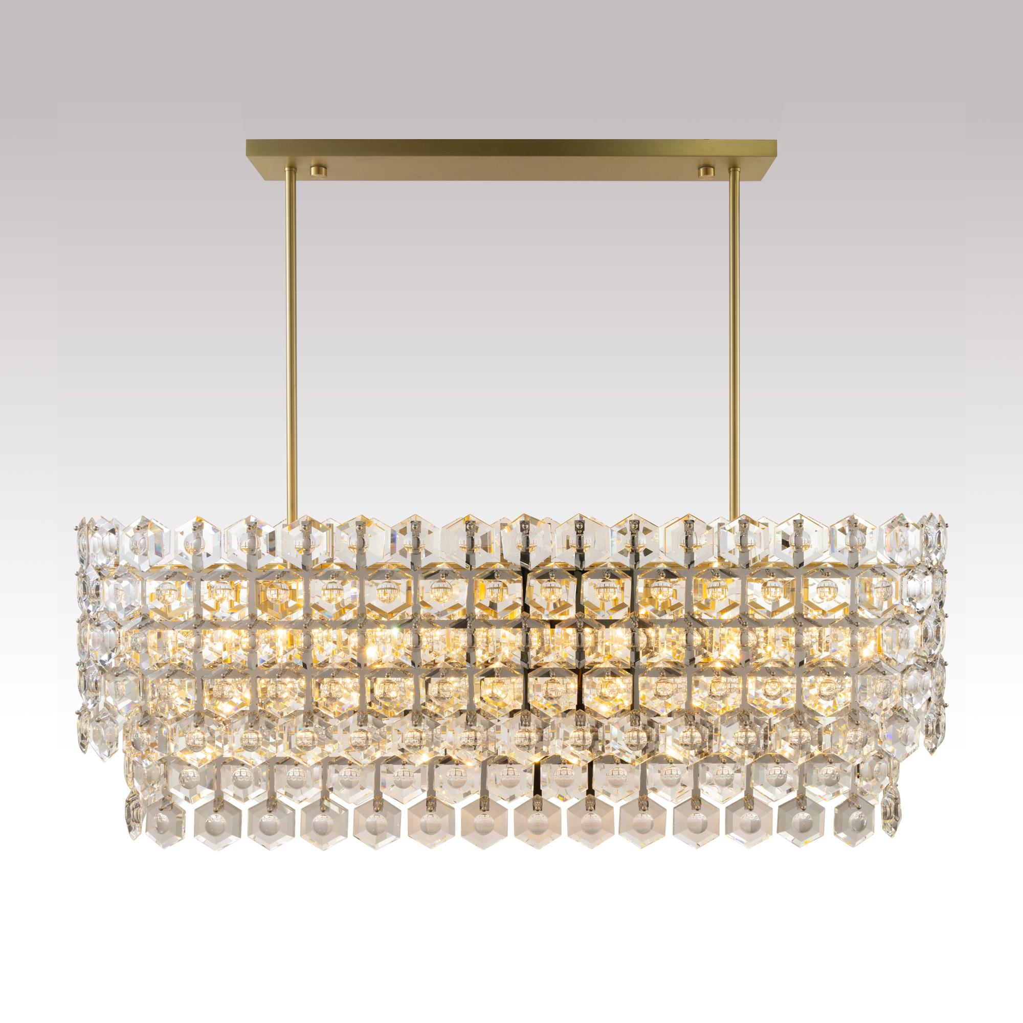 Halos of luxurious crystal hexagons - faceted with a custom carved concave detail - defuse and refract light within and throughout. Elusive and illusory, BELLAZA casts a symphony of light and shadow.

Offered in single and layered double tiers with