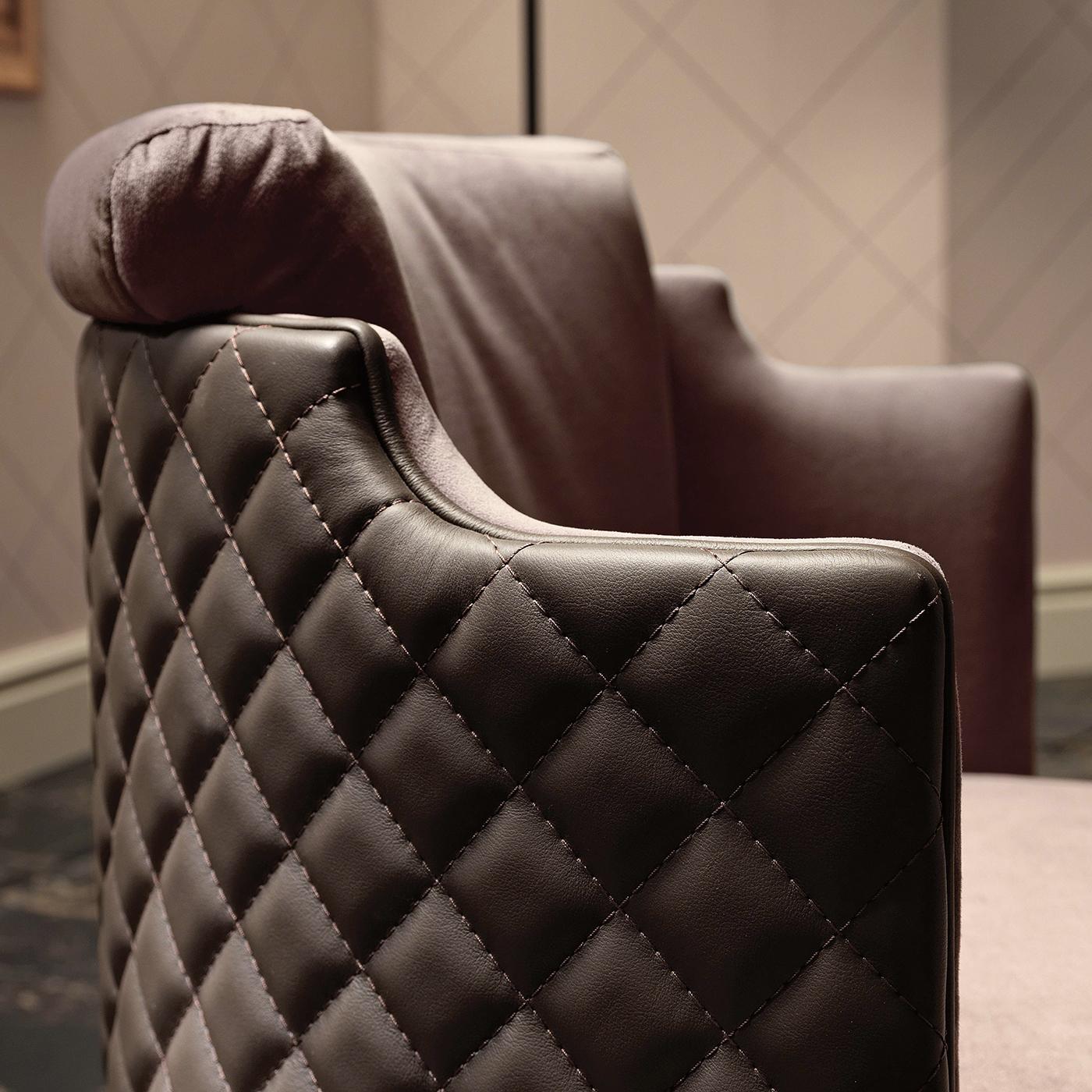 This plush armchair will be an exclusive addition to a spacious walk-in closet in the bedroom or a living room decor. This design by Marzia and Leo Dainelli is handcrafted of solid wood with a plinth swivel base with a 360-degree range of motion.