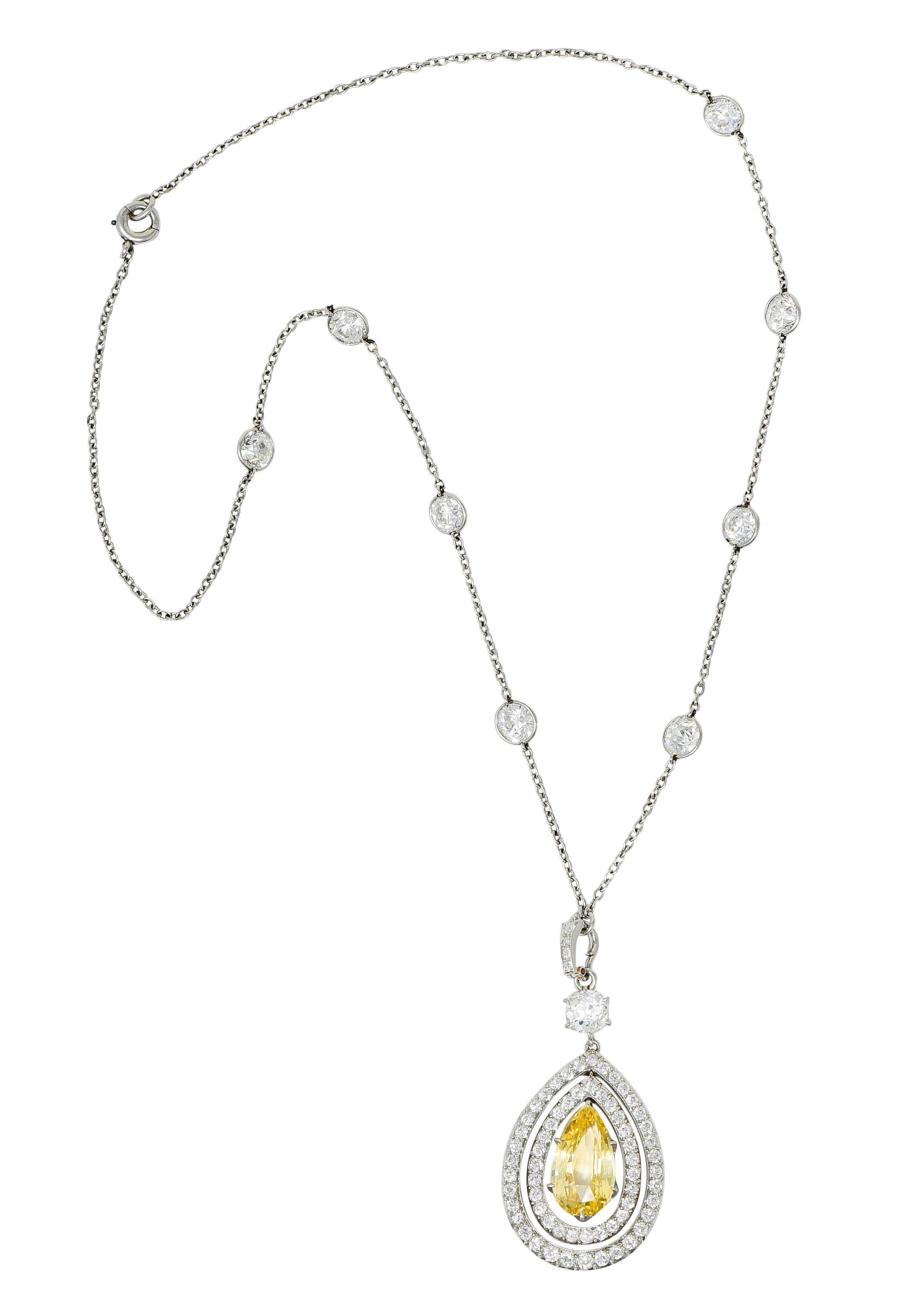 Designed as a diamonds-by-the-yard style chain suspending a double halo pear shaped enhancer, fully articulated,

Old European cut diamonds bezel set on chain weigh in total approximately 5.60 carats; H/I color with VS to SI clarity

Centering a