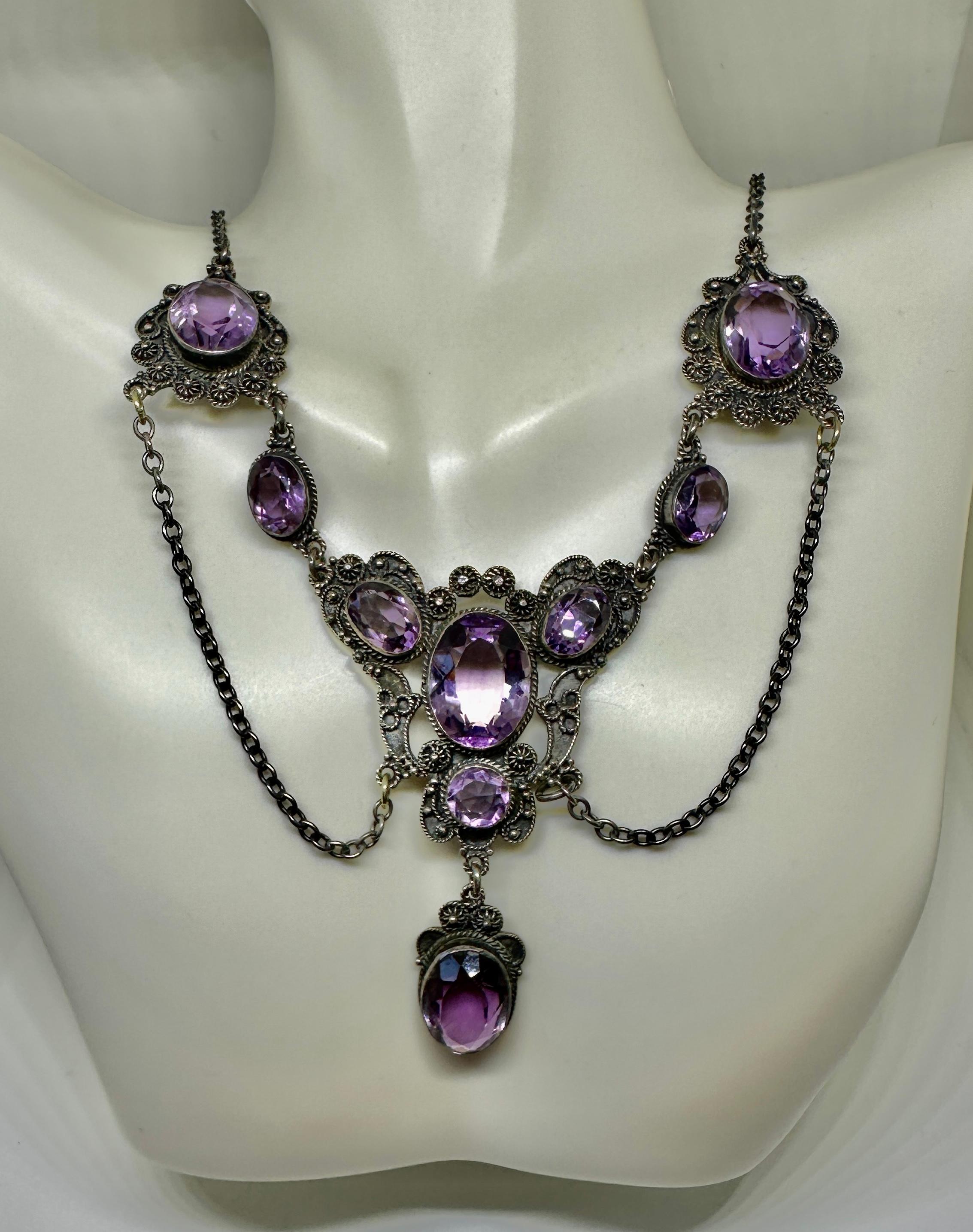 INDULGE IN A RARE MUSEUM QUALITY ART NOUVEAU - BELLE EPOQUE FESTOON NECKLACE WITH THE MOST GORGEOUS NATURAL OVAL AND ROUND SHAPE AMETHYST GEMS SET IN A GORGEOUS SCROLL AND BEADED NECKLACE IN AN OPEN WORK FESTOON SWAG DESIGN IN STERLING SILVER DATING