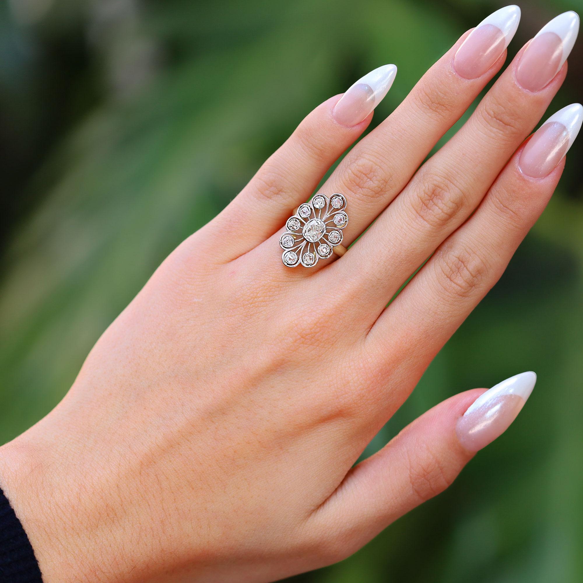 The Belle Epoque Edwardian old mine cut diamond dinner ring we just acquired is an outstanding example of two concurrent eras. A curvaceous, openwork, lacy and feminine ring with a distinct presence, set with 11 chunky, sparkling 