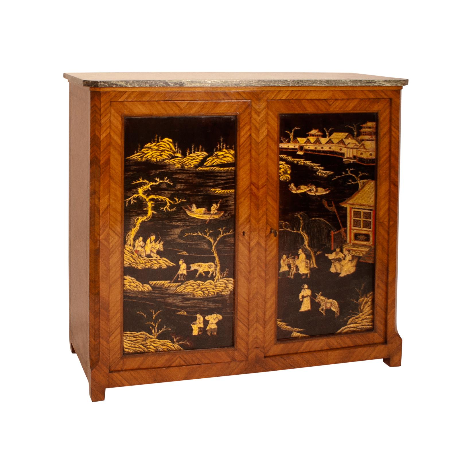A French Belle Époque cabinet decorated with Chinoisiere panels and a marble top, circa 1900. This piece is very decorative and unusually narrow. The marble top make is useful in a high traffic area like an entry hall. Pieces like these where first
