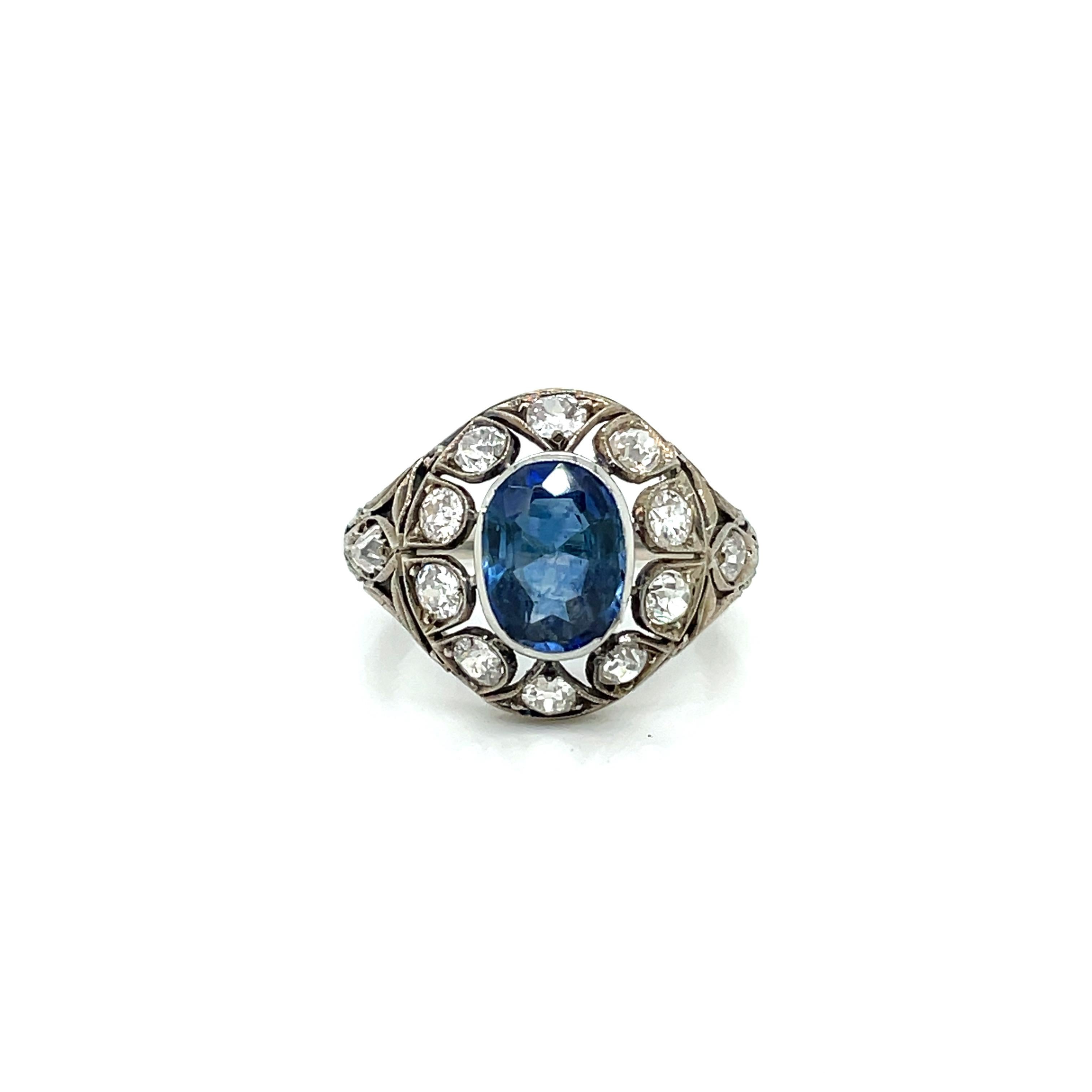 An exquisite filigree ring set in 18k gold, authentic from Art Nouveau era, featuring a beautiful 2.44 ct Oval-cut Sapphire, surrounded by 2.50 carats of old cut diamonds. 
The Sapphire is accompanied by a Gemological certificate.

There are not