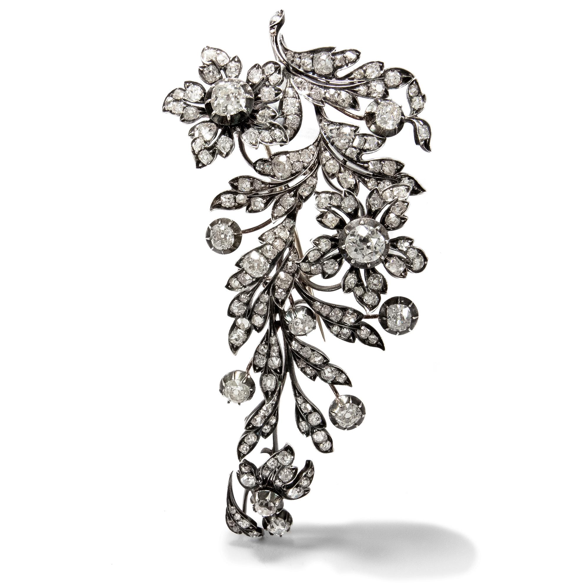 What fascinates us about antique jewellery pieces, besides the exquisite craftsmanship they showcase, are their stories. With this large floral spray brooch, dating to the years around 1880, we are made to think of the countless balls and soirées it