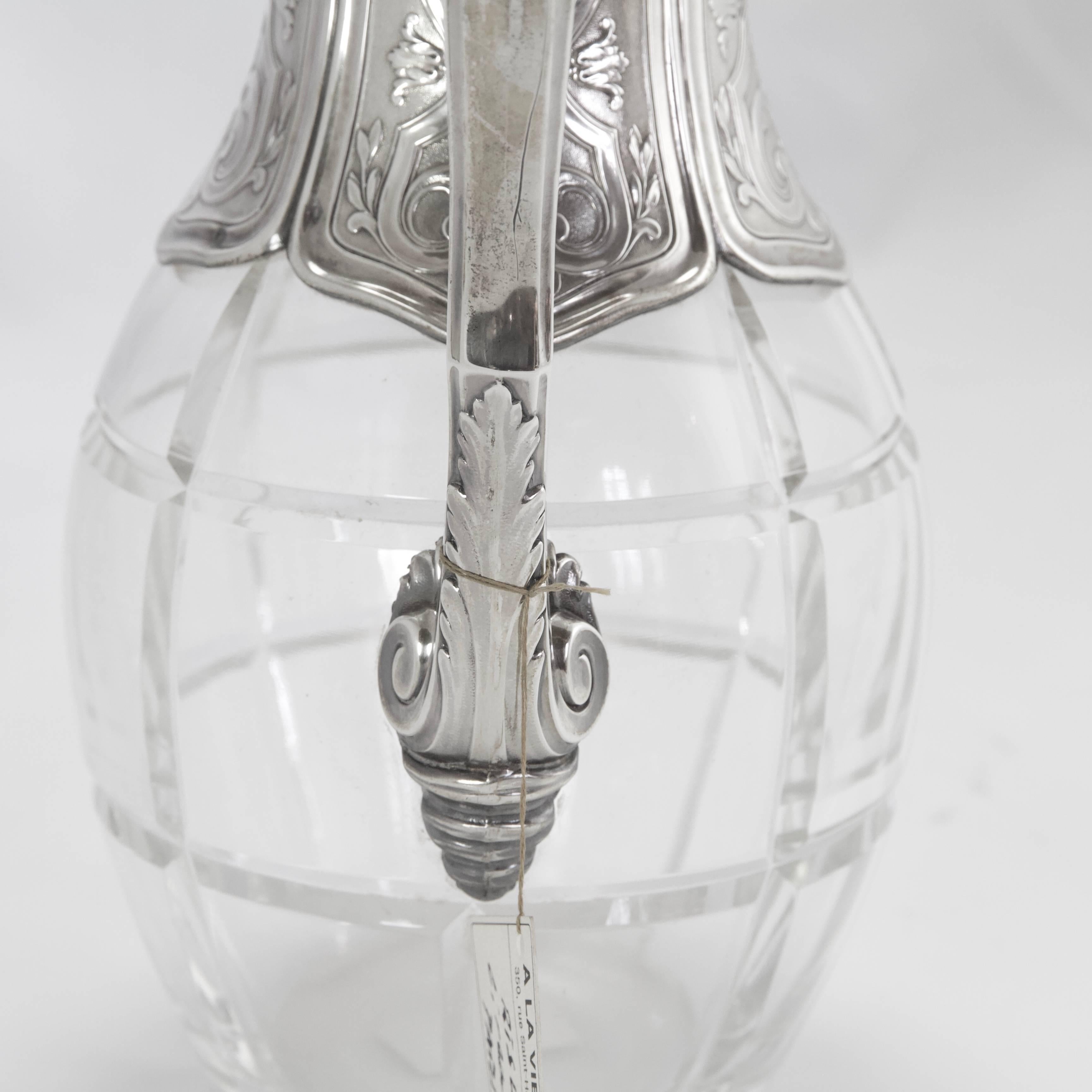 Carved crystal and top in sterling silver decorated with scroll and swirling pattern in taste of Regency style. Interior gilded.
Made by Risler, circa 1900. Maker's mark
French assays marks.
 