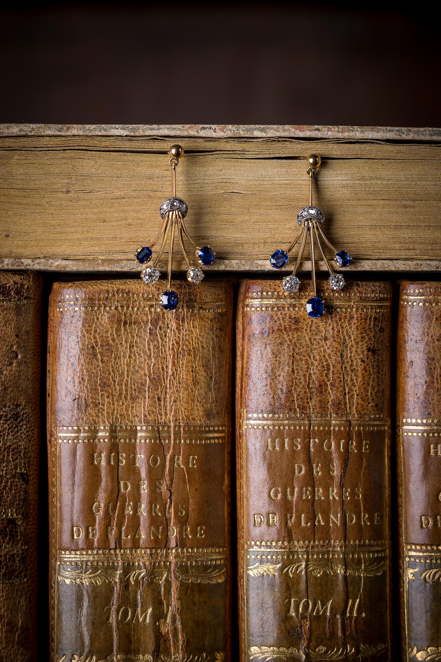 Pair of playful diamond and sapphire earrings. Superb velvety blue that makes you wanna dive in. Joyful energy, artistic playfullness and exuberant optimism. These earrings are great examples of the time they were made – early 20th century – la