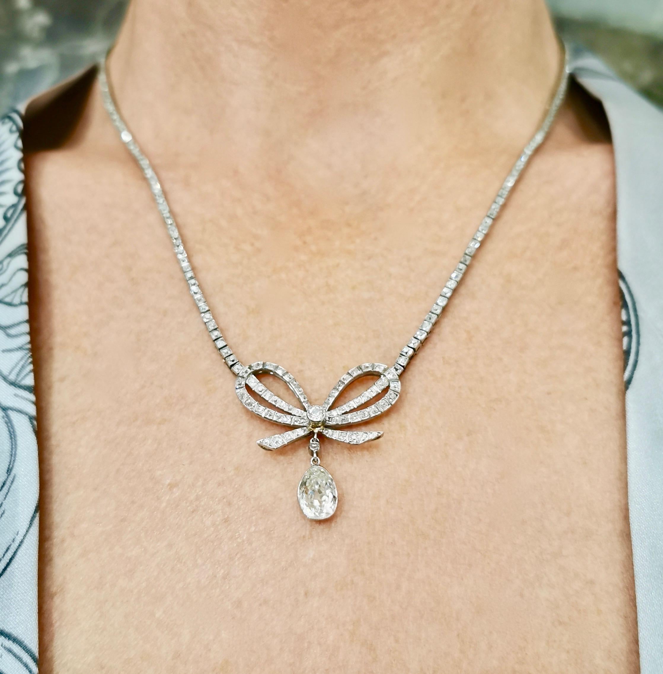 Old Mine Cut Belle Époque Diamond Platinum Bow Pendant Necklace For Sale