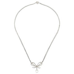 Belle Époque Diamond Platinum Bow Pendant Necklace