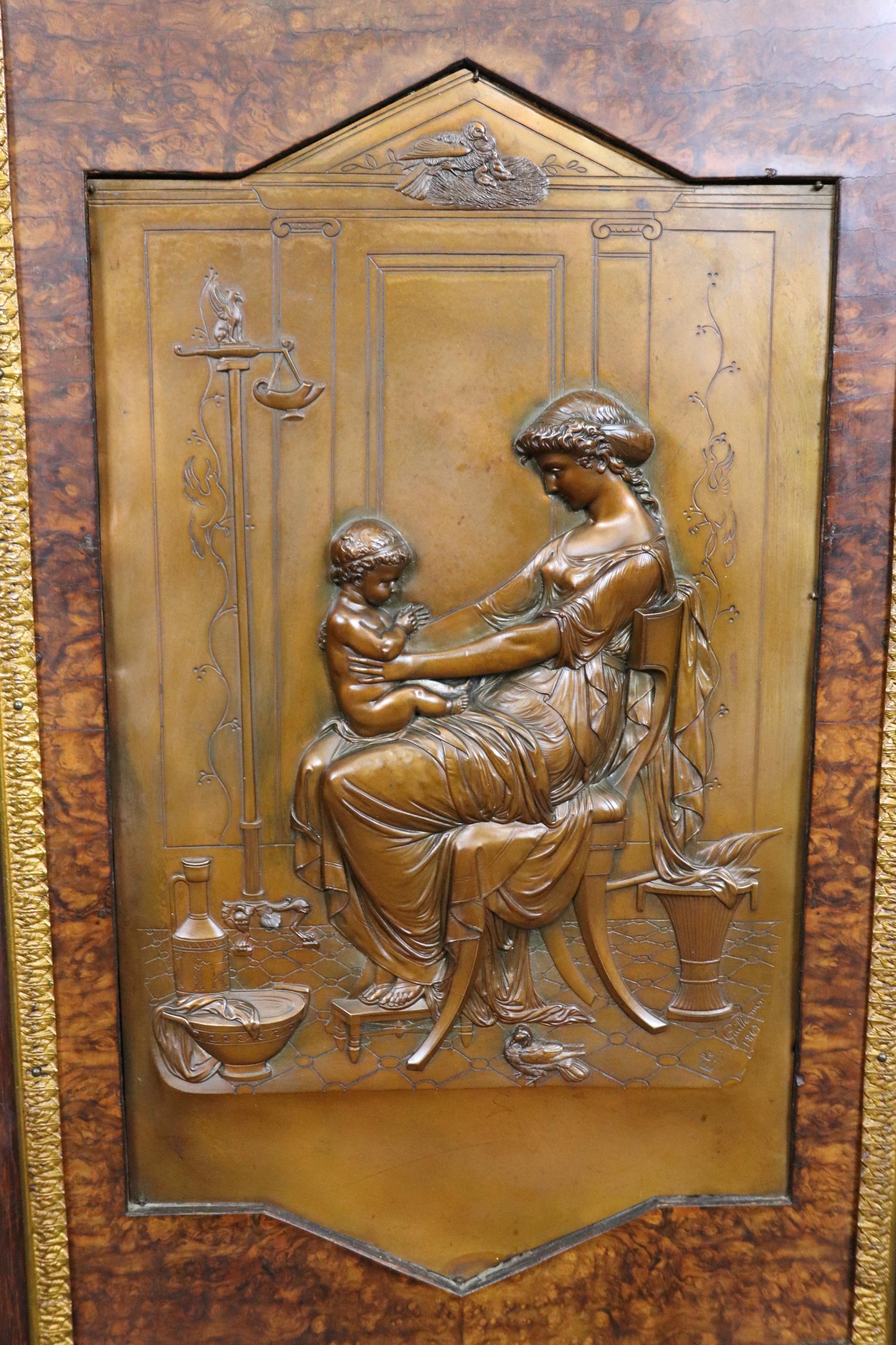This is a rare and incredibly well-defined marble top cabinet with bronze sculptural plaques by Emile Guillemin. The walnut and birch case features incredible bronze gilt ormolu and a fine slab of gorgeous marble on top. The coordination of marble,