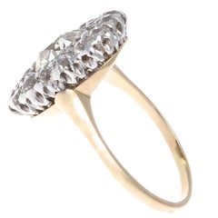 Belle Époque French 1.60 Carat Old Oval Cut Diamond Gold Platinum Cluster Ring