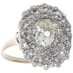 Belle Époque French 1.60 Carat Old Oval Cut Diamond Gold Platinum Cluster Ring