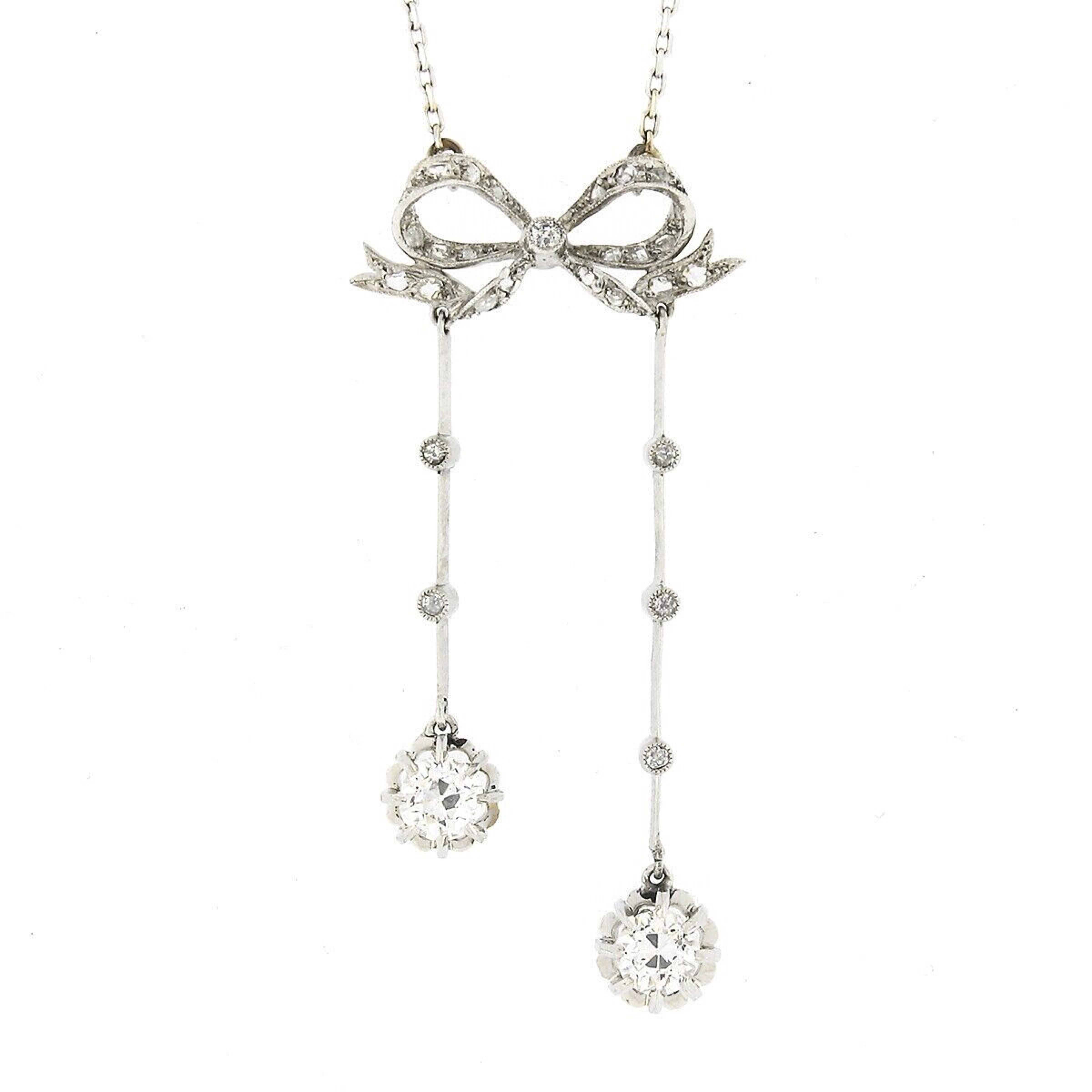 This absolutely beautiful antique pendant was crafted during the Belle Epoque era from solid 18k white gold and features old cut diamonds neatly set in a drop dangle style, bringing a remarkable amount of brilliance and shine to this piece. The