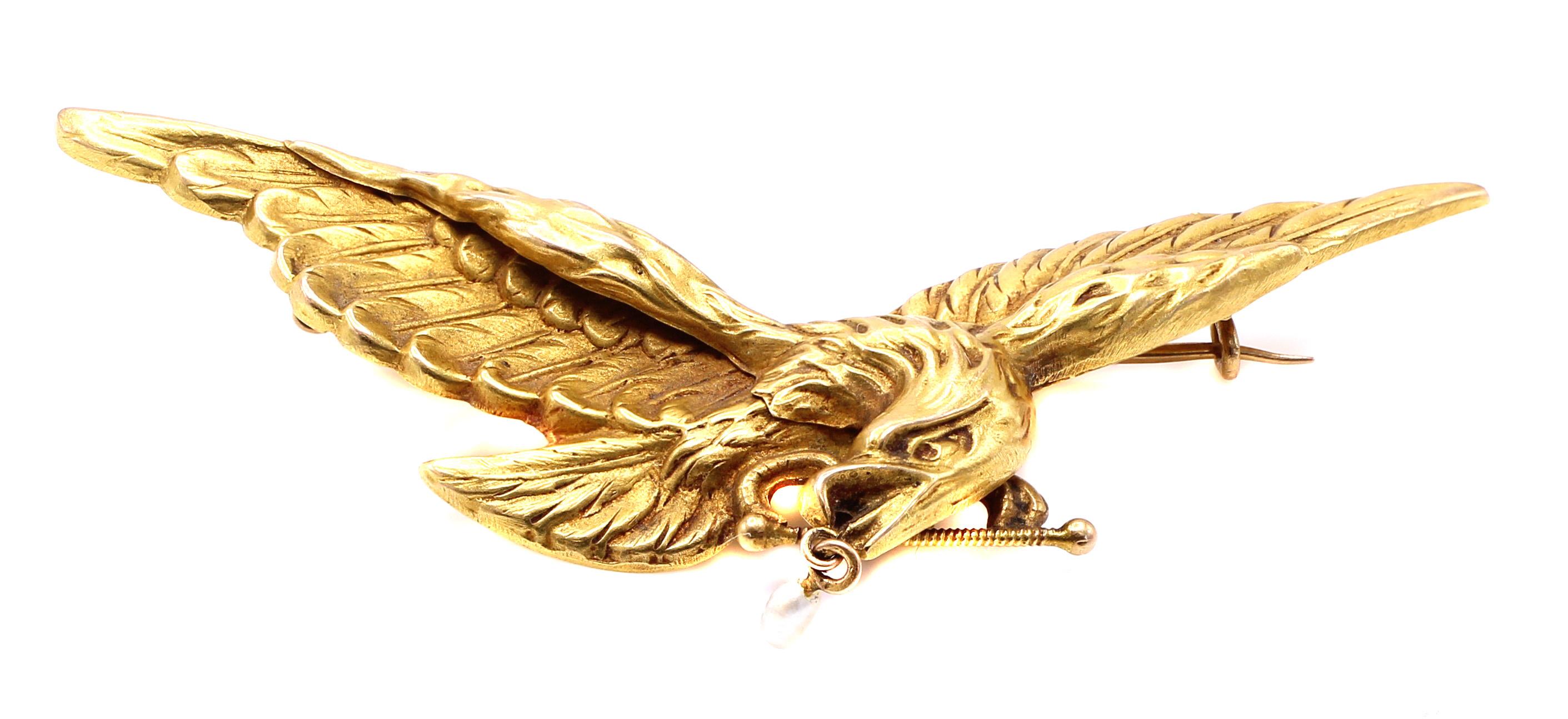 Beautifully designed and masterfully handcrafted this Belle Epoque 18 karat yellow gold brooch depicts a flying bald eagle. Wonderful three dimensional detailed hand engraving give this brooch an amazing realistic appearance. This most collectable