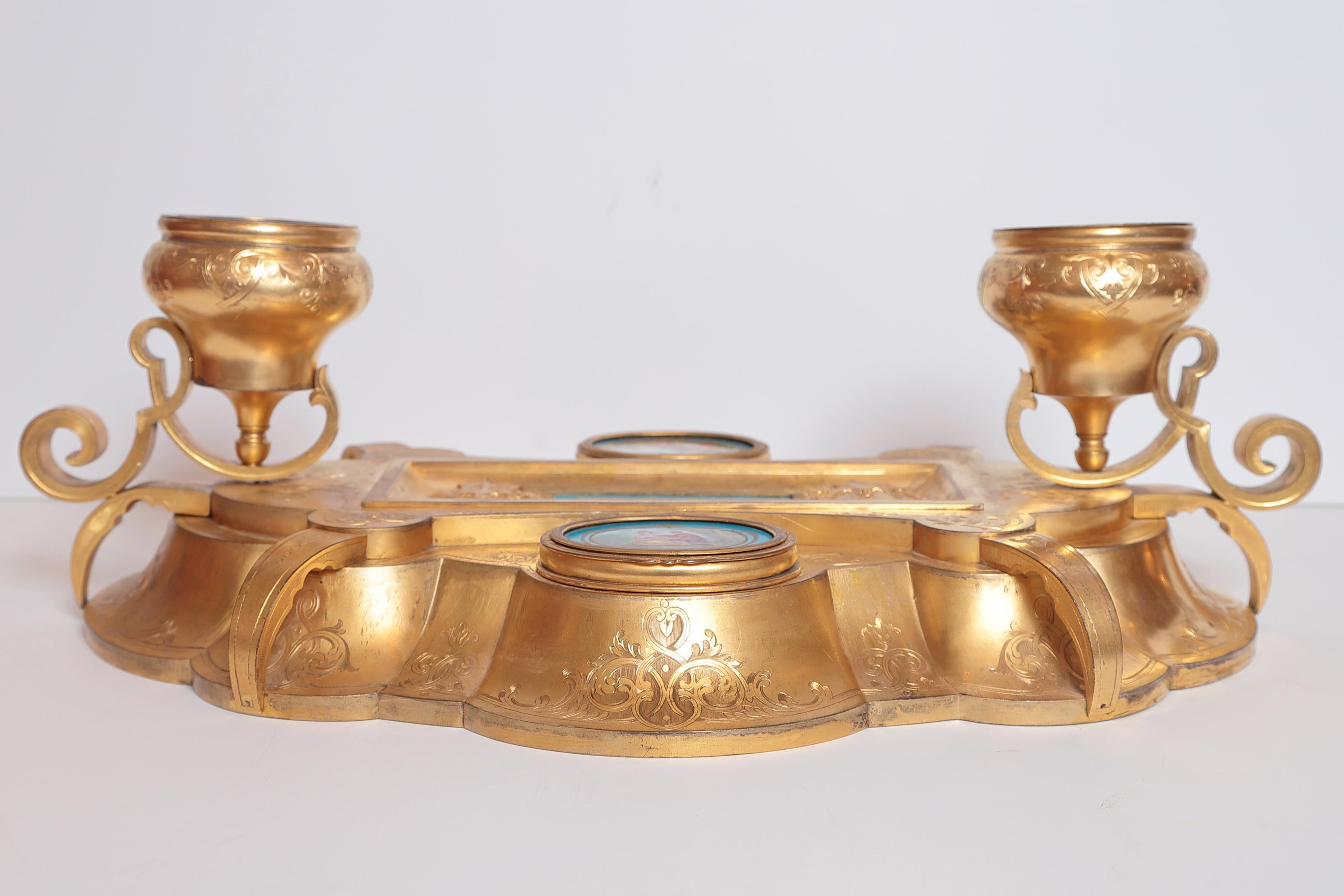 Beautiful large 19th century French Belle Époque inkwell. Grand gilt bronze with many compartments decorated with Sevres porcelain plaques.








  