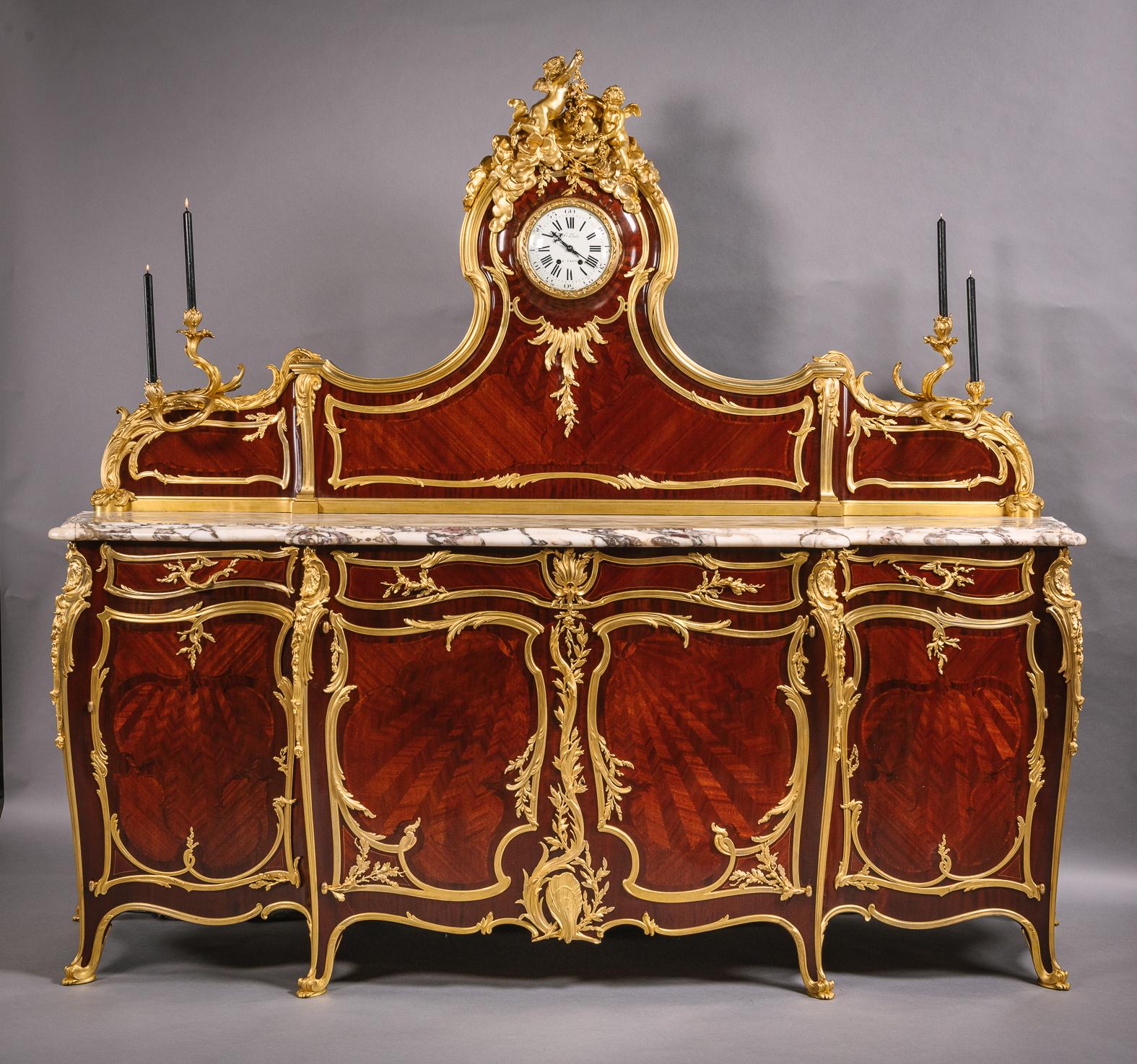 A Rare  Belle Epoque Gilt-Bronze Mounted Parquetry Inlaid Grand Buffet, By François Linke, The Mounts Designed by Léon Messagé. 

Signed to the right corner clasp ‘Linke’ 
The enamel clock dial with Roman numerals and Signed ‘F Linke A PARIS’.	
The