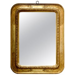 Espejo de pared rectangular redondeado italiano de la Belle Époque tallado a mano en pan de oro