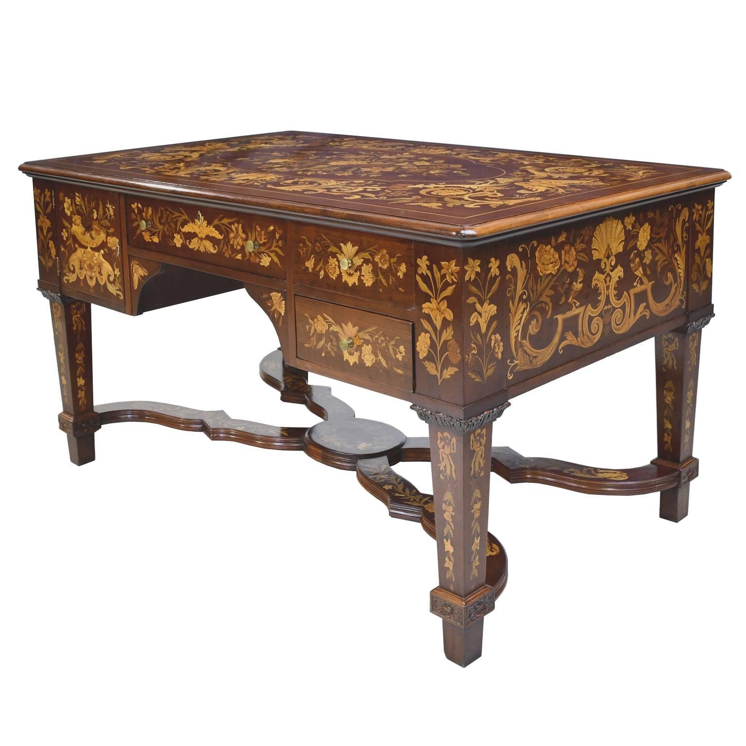 An exceptionally beautiful & functional Belle Époque partners' desk in mahogany that is identical on both sides, with working drawers & cabinet doors. Marquetry is on all surfaces, including cross stretcher on bottom, & features decorative inlays in