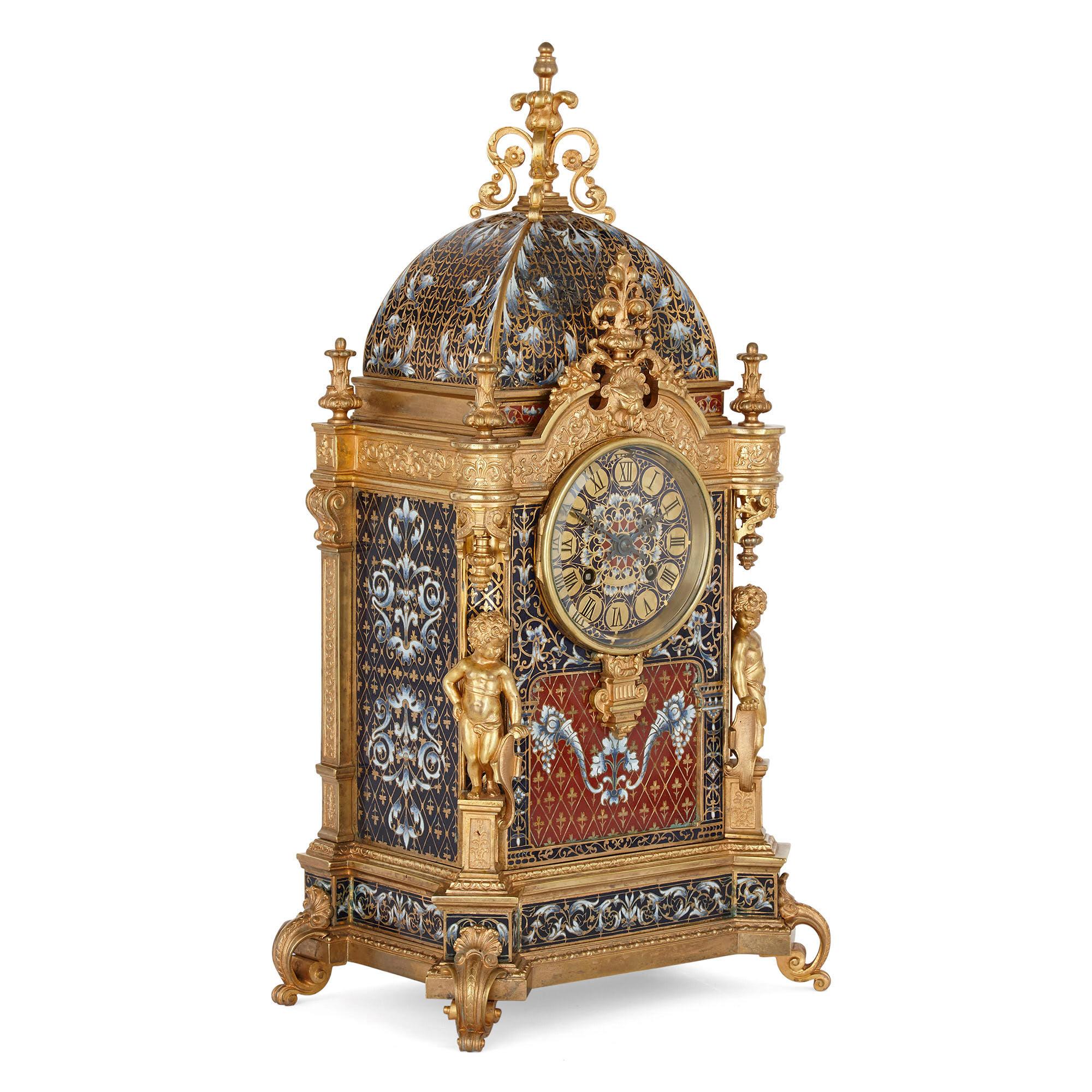 Belle Époque period gilt bronze and enamel clock set
French, late 19th century
Measures: Clock: Height 46cm, width 23cm, depth 15cm
Vases: Height 29cm, diameter 11.5cm
Candlesticks: Height 26.5cm, diameter 10cm

This superb clock set comprises